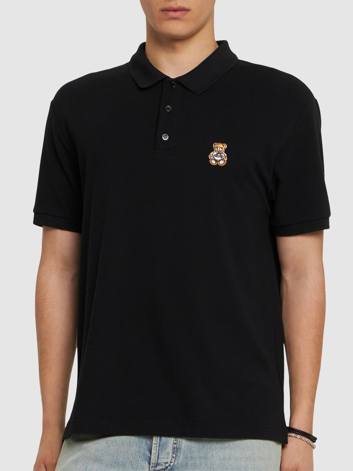 Shop Moschino Teddy Logo Patch Polo Shirt In 黑色