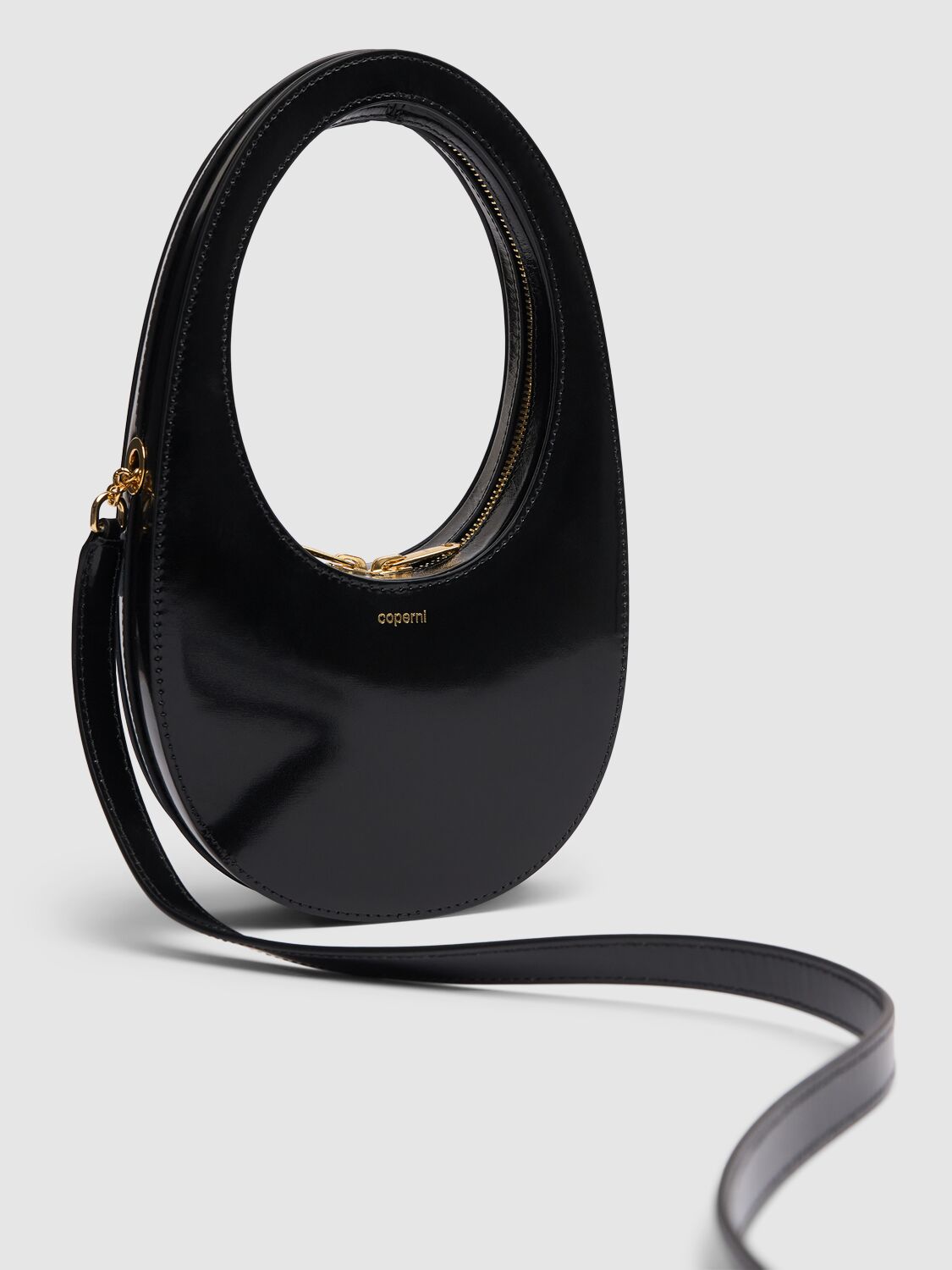 Shop Coperni Mini Swipe Gloss Leather Crossbody Bag In Black