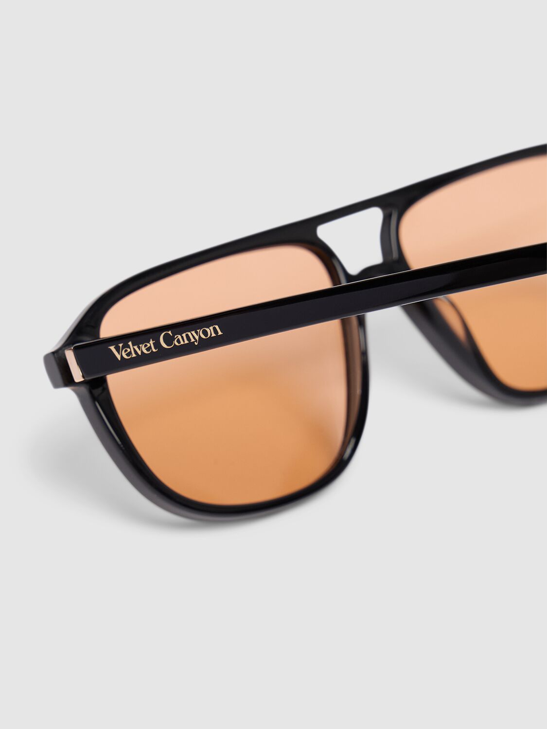 Shop Velvet Canyon La Touriste Pilot Acetate Sunglasses In Black/amber