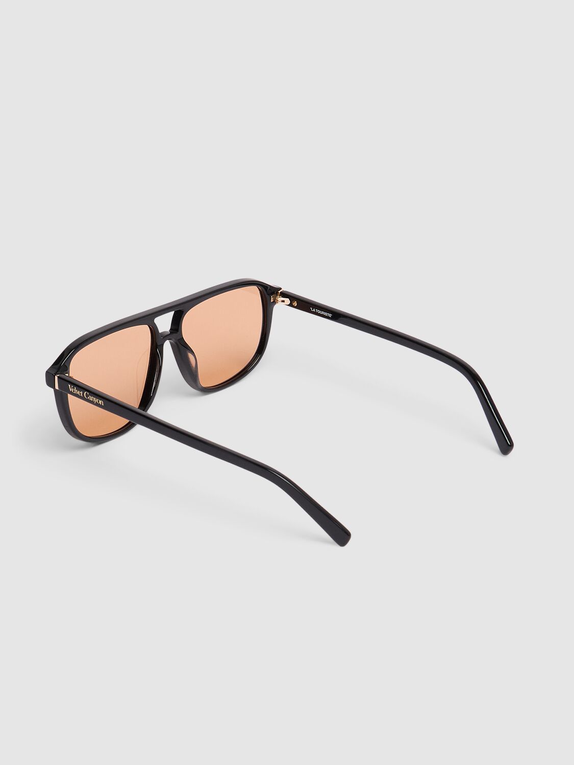 Shop Velvet Canyon La Touriste Pilot Acetate Sunglasses In Black/amber