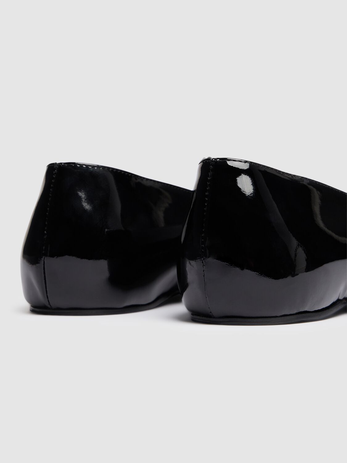 Shop Totême 5mm The Patent Asymmetric Ballerinas In Black