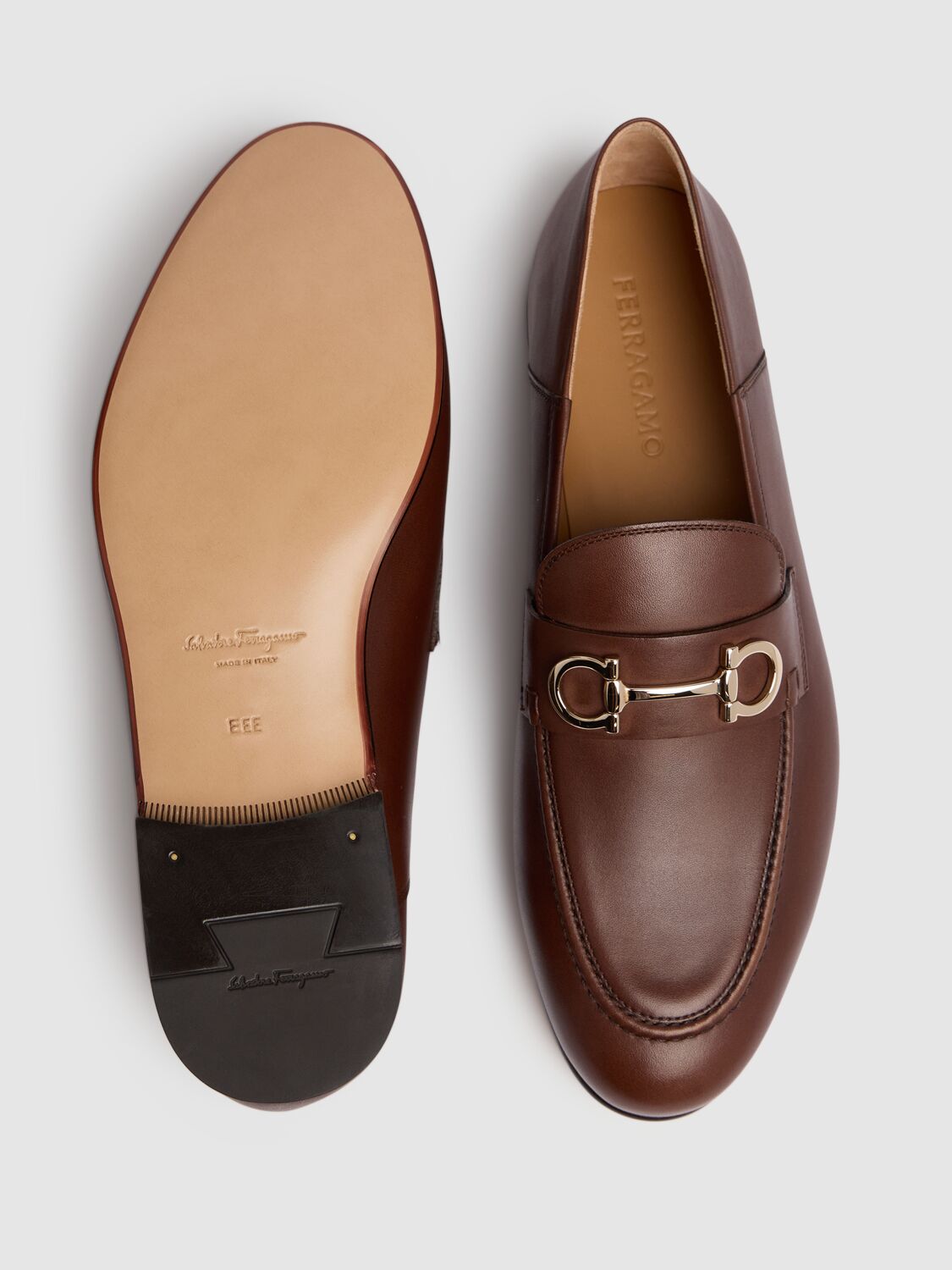 Shop Ferragamo Gin Leather Loafers In Cioccolato