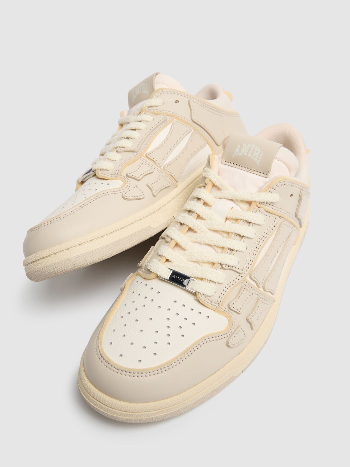 Shop Amiri Collegiate Skel Top Low Sneakers In White/beige