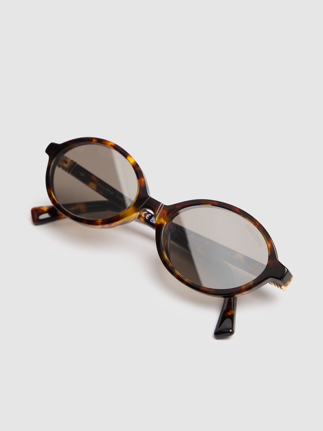 Shop Miu Miu Round Acetate Sunglasses In Havana,grey