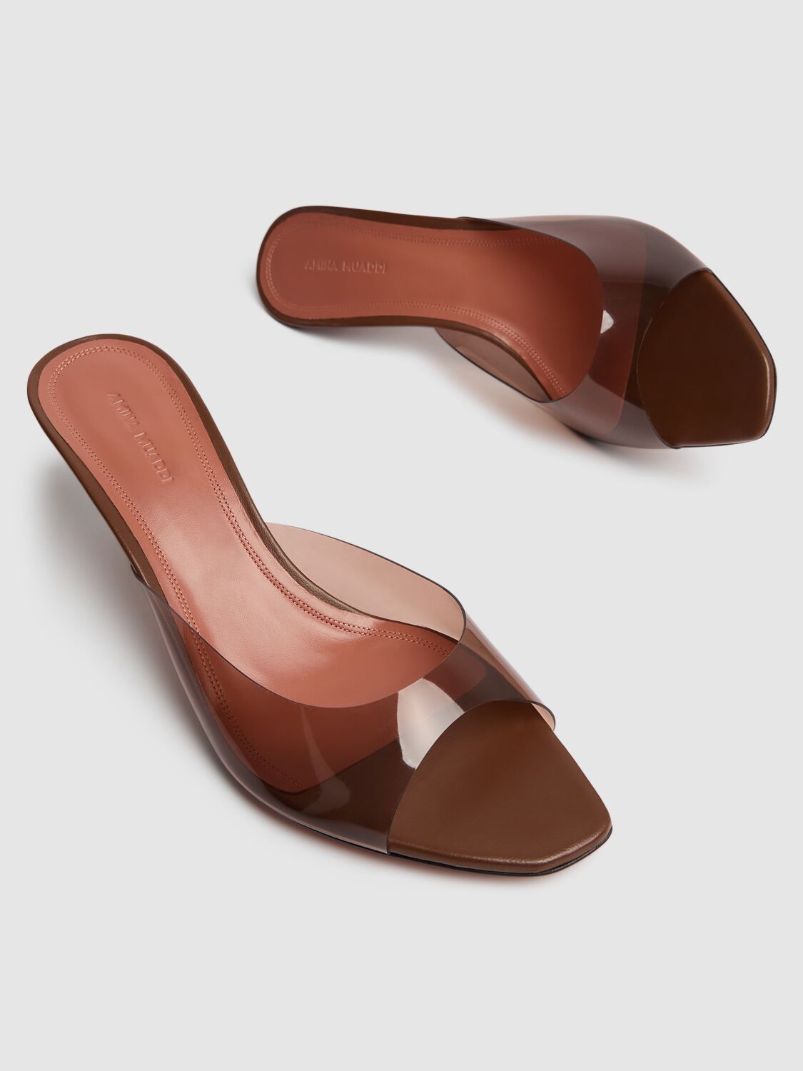 Shop Amina Muaddi 60mm Alexa Pvc Mules In Brown