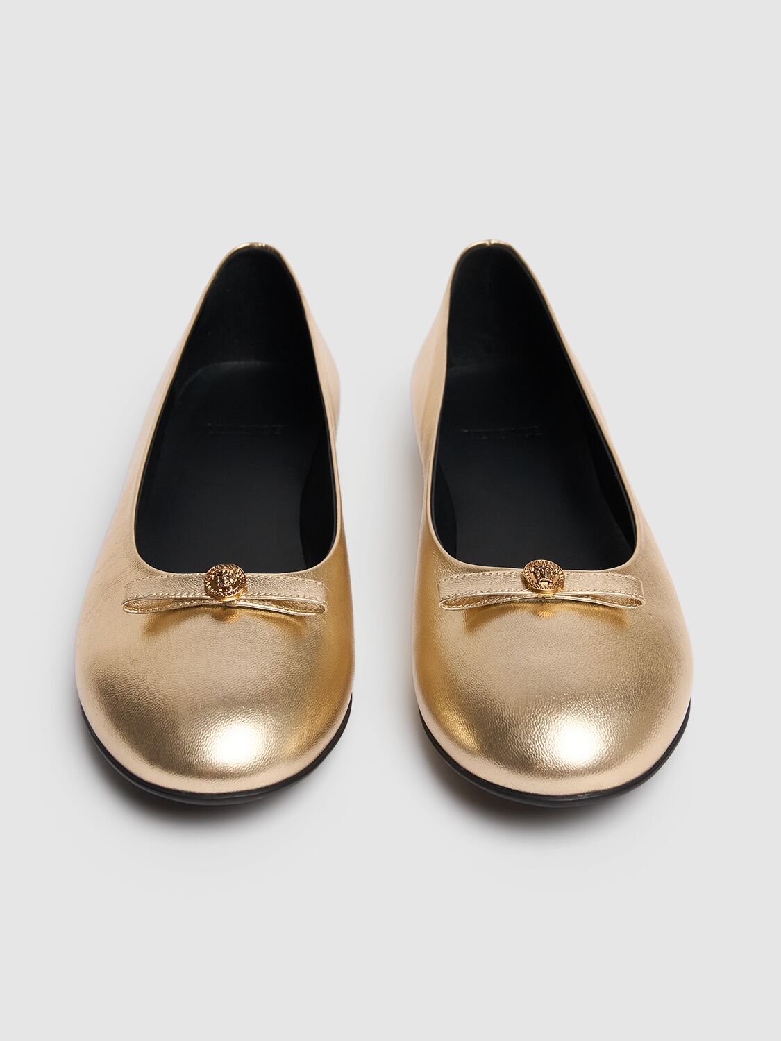 Shop Versace Metallic Leather Ballerinas W/bow In Gold