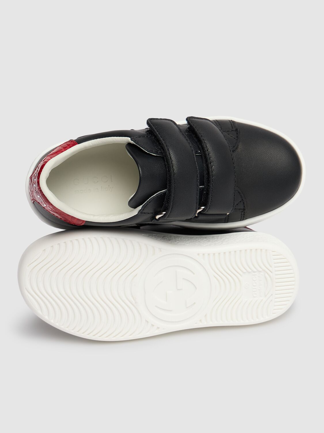 Shop Gucci Embossed Leather Sneakers In Black