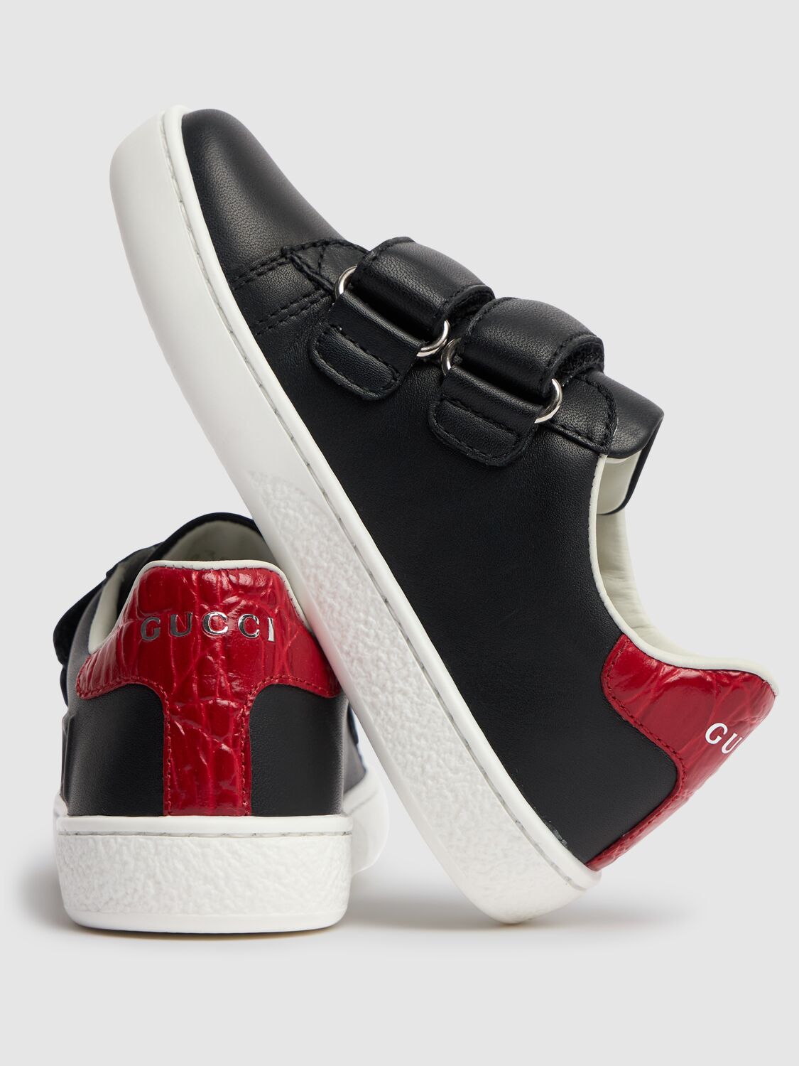 Shop Gucci Embossed Leather Sneakers In Black