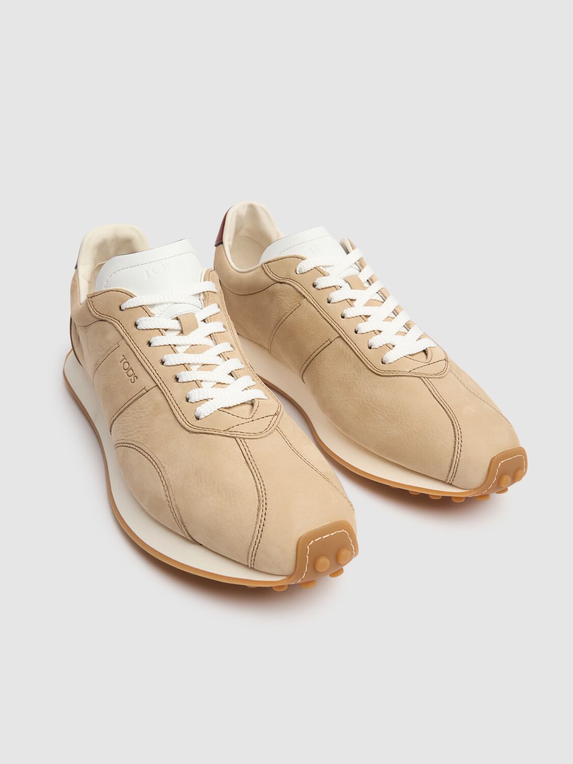 Shop Tod's Suede Low Top Sneakers In Beige