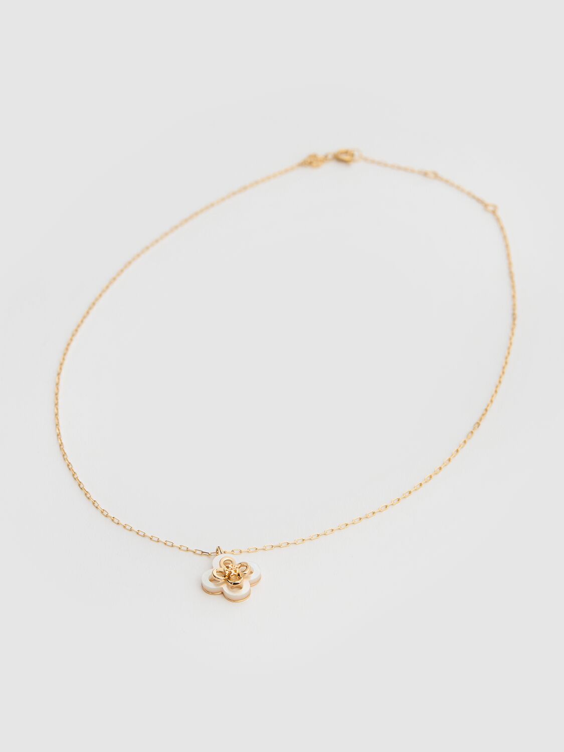 Shop Tory Burch Kira Clover Pendant Necklace In Tory Gold / Mot