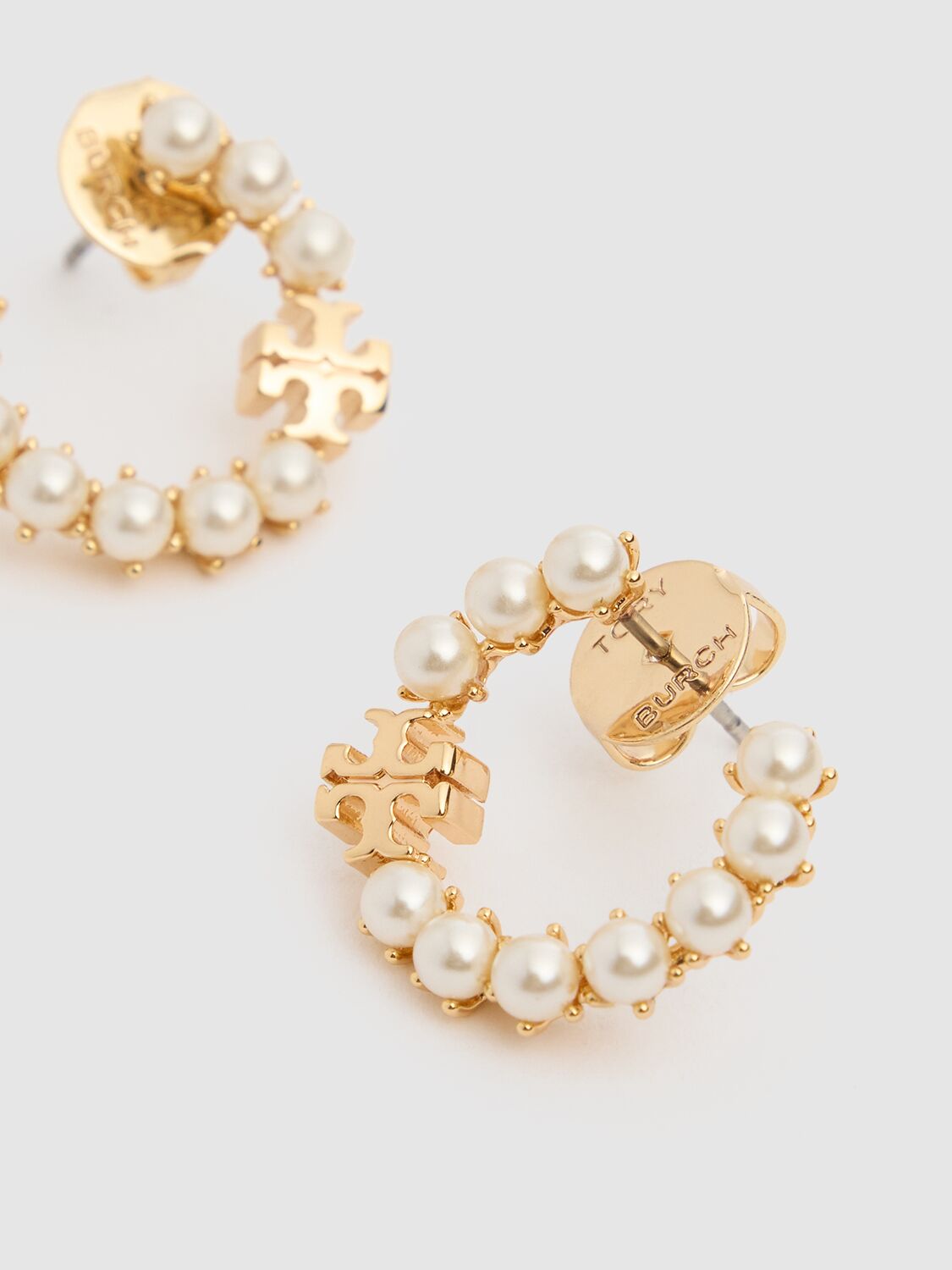 Shop Tory Burch Kira Faux Pearl Loop Earrings In Pearl/gold