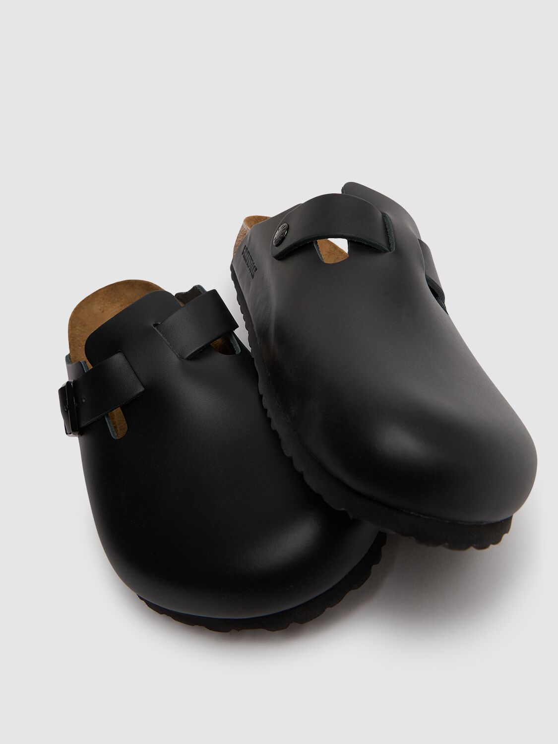 Shop Birkenstock Boston Natural Leather Mules In Black