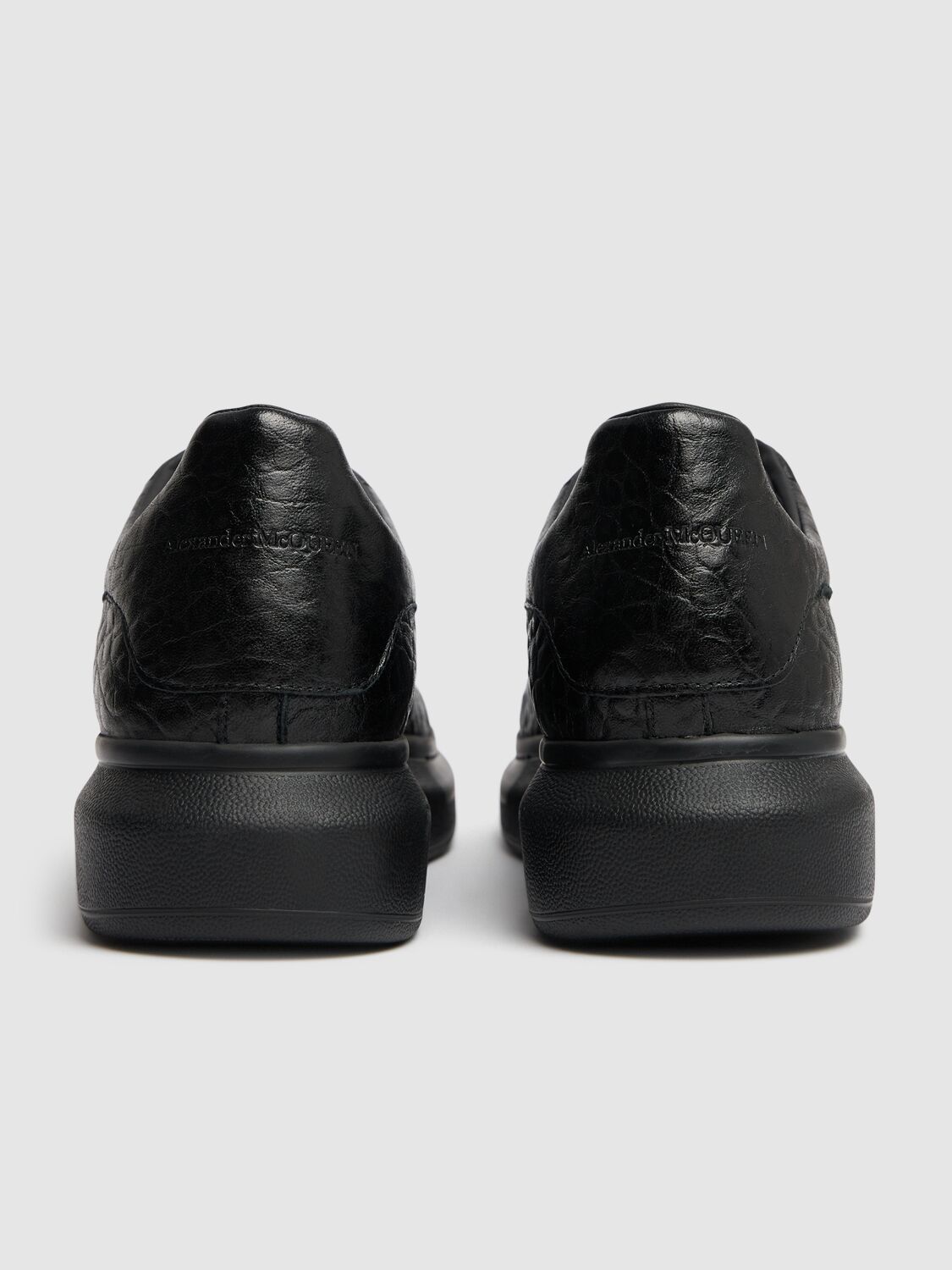 Shop Alexander Mcqueen Oversized Leather Sneakers In Black