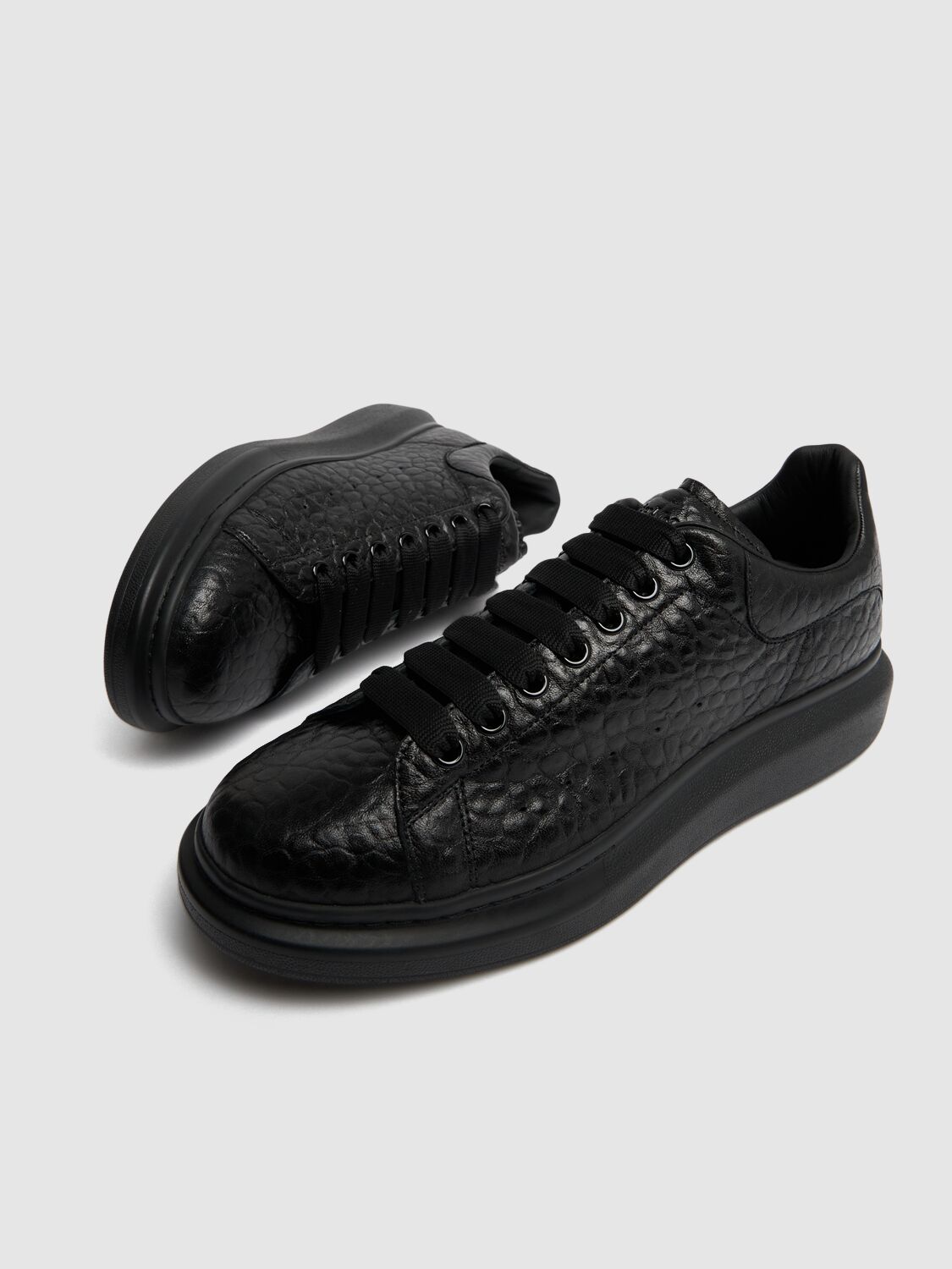 Shop Alexander Mcqueen Oversized Leather Sneakers In Black