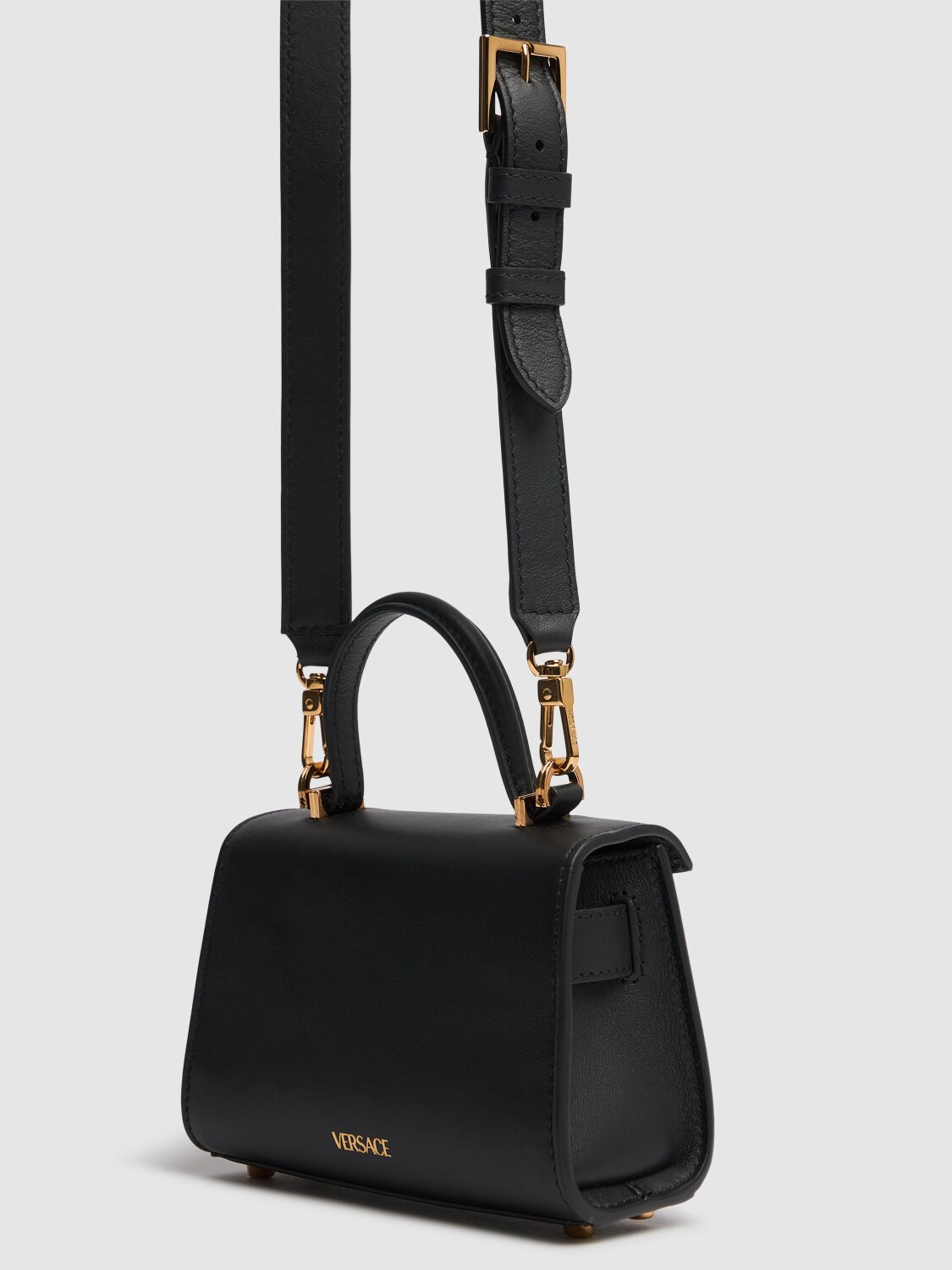 Shop Versace Mini Medusa '95 Leather Top Handle Bag In Black