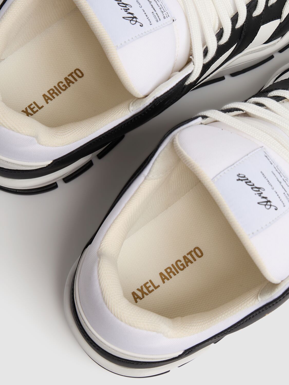 Shop Axel Arigato Area Lo Sneakers In White/black