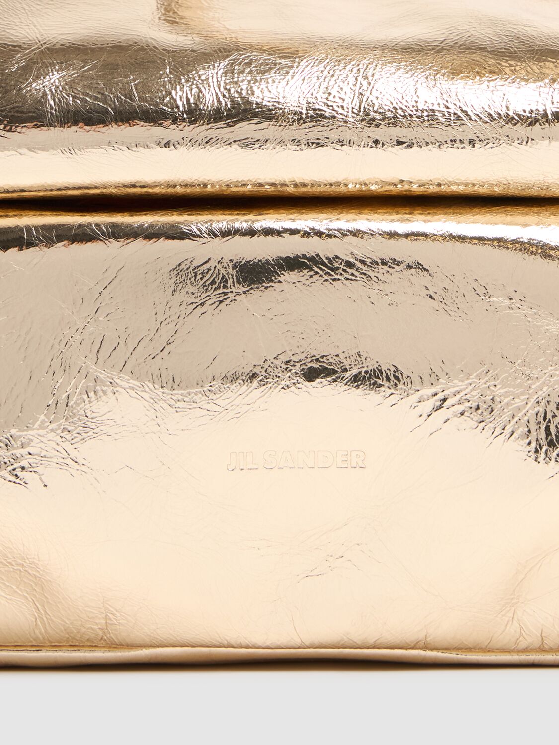 Shop Jil Sander Small Rollup Metallic Leather Bag In Platinum