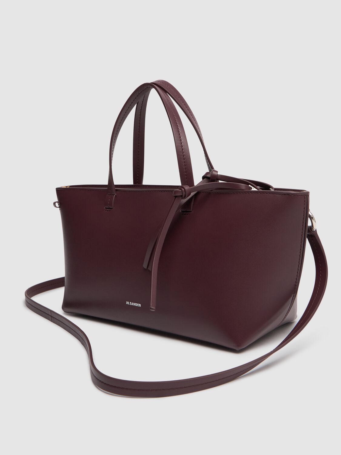 Shop Jil Sander Small Bateau Smooth Leather Bag In Plum