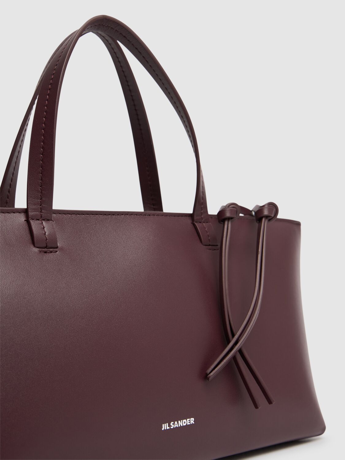 Shop Jil Sander Small Bateau Smooth Leather Bag In Plum