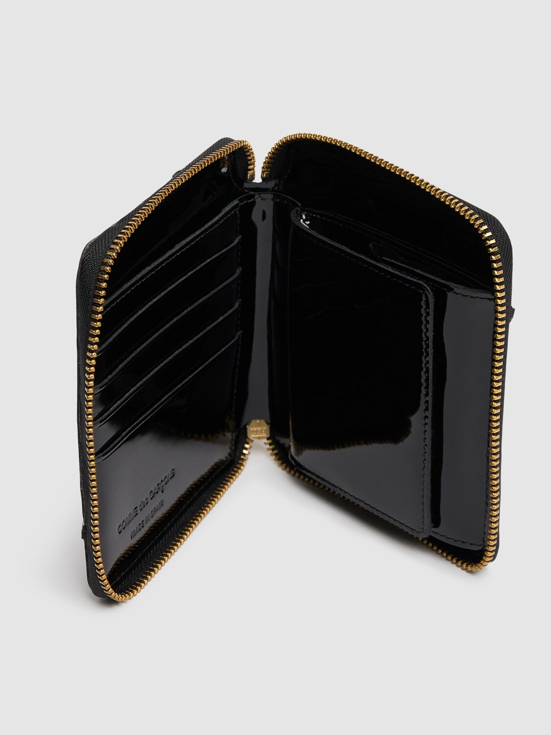COMME DES GARÇONS REVERSED HEM PATENT ZIP AROUND WALLET 