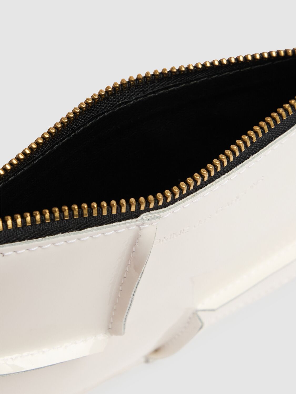 COMME DES GARÇONS REVERSED HEM PATENT ZIP WALLET 