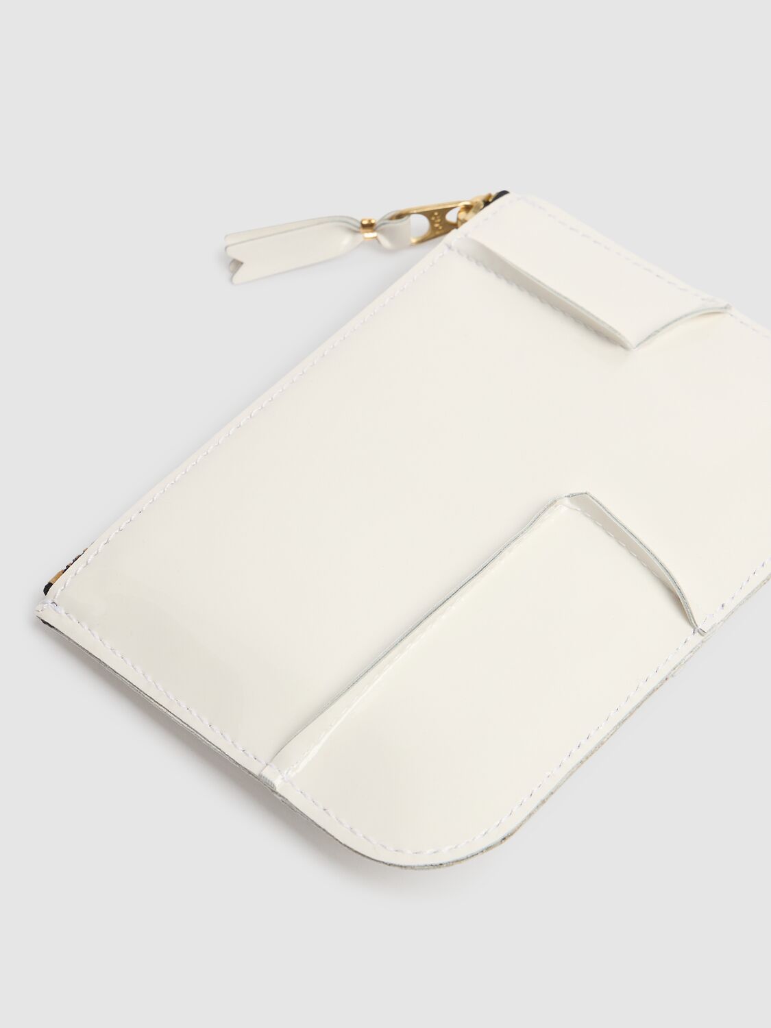 COMME DES GARÇONS REVERSED HEM PATENT ZIP WALLET 