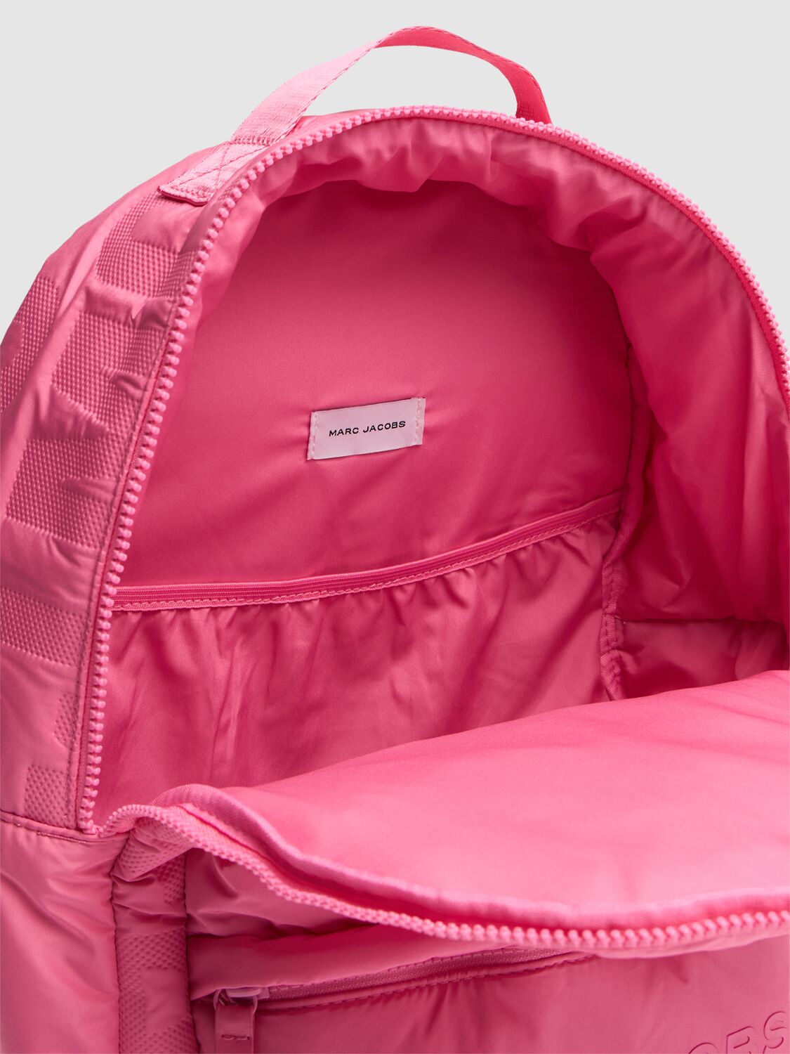 Shop Marc Jacobs Monogram Embossed Poly Backpack In Fuchsia