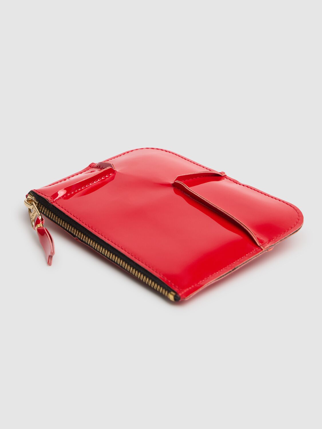 COMME DES GARÇONS REVERSED HEM PATENT ZIP WALLET 