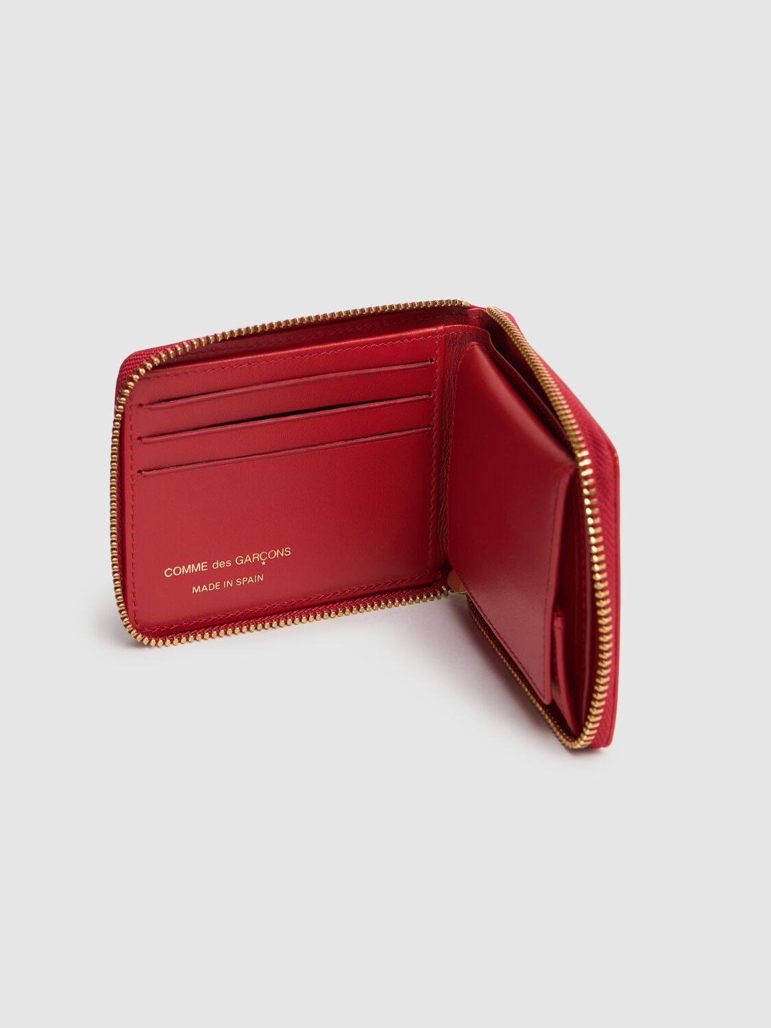 COMME DES GARÇONS DOT PRINTED LEATHER ZIP AROUND WALLET 