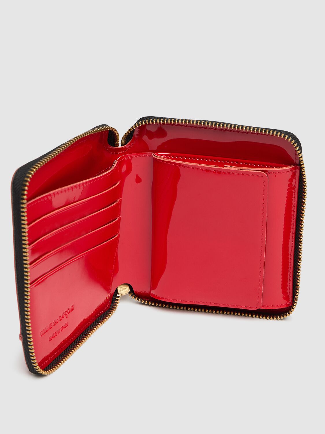 COMME DES GARÇONS REVERSED HEM PATENT ZIP AROUND WALLET 