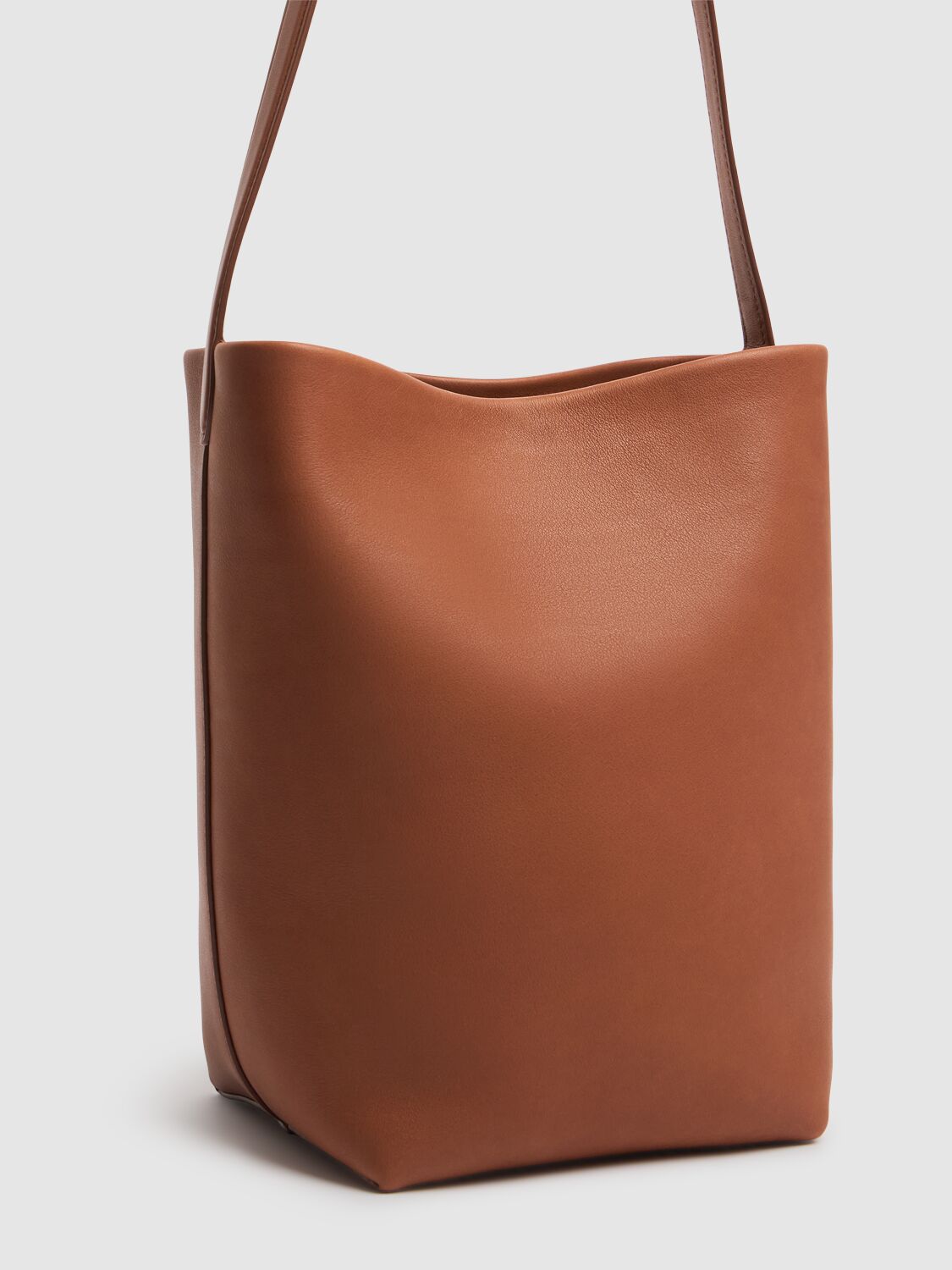 The Row Medium N/s Park Saddle Shiny Leather Bag In Dark Cuir