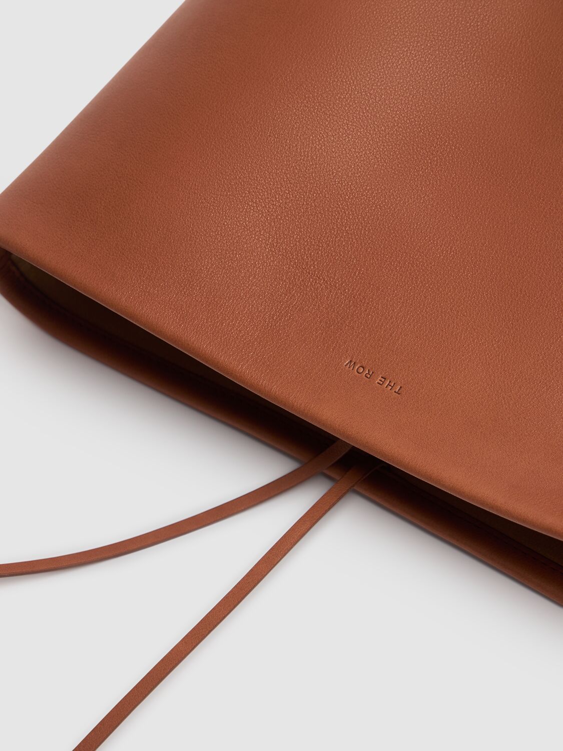 The Row Medium N/s Park Saddle Shiny Leather Bag In Dark Cuir