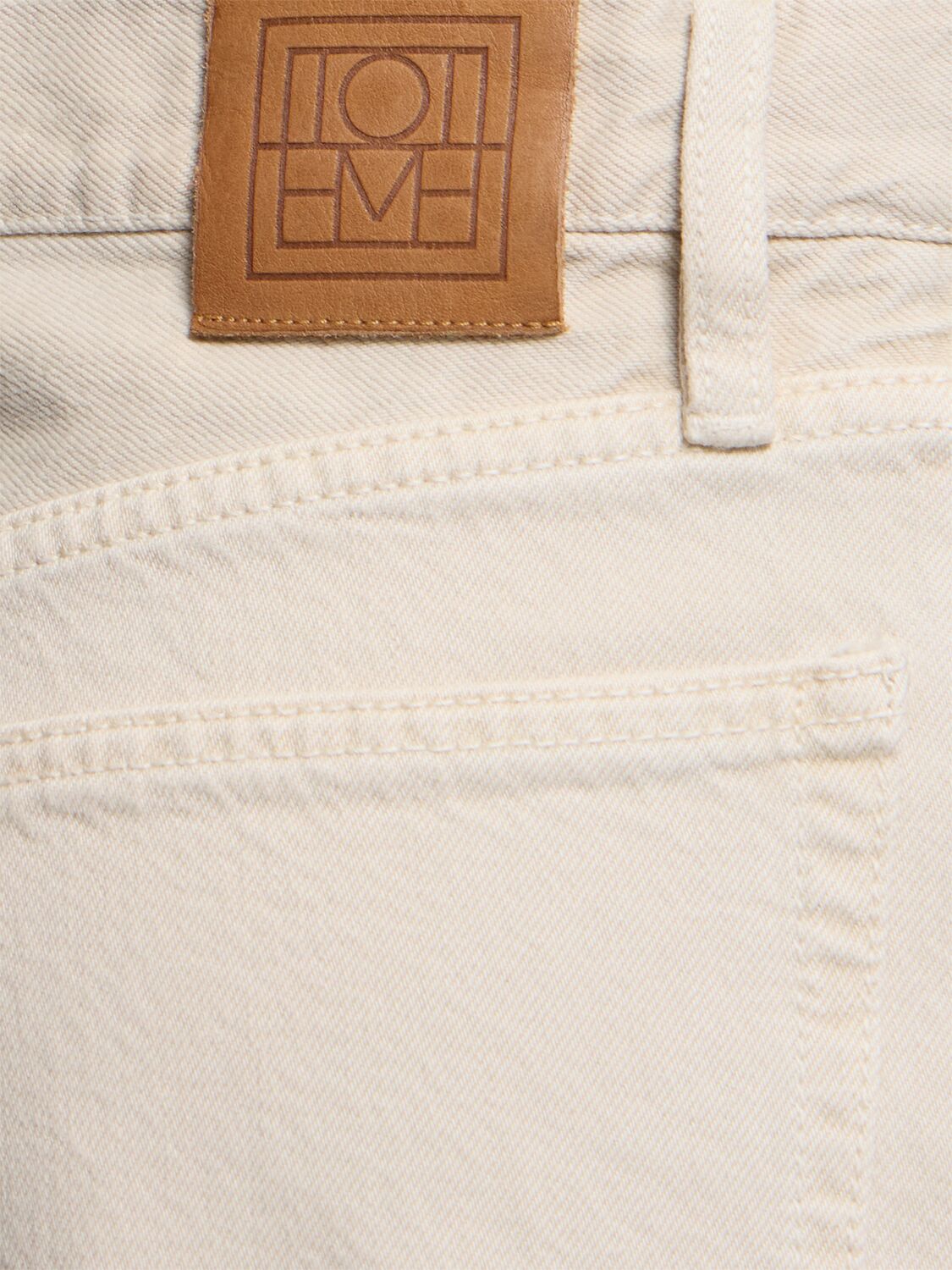 Shop Totême Twisted Seam Mid Rise Denim Jeans In Grey