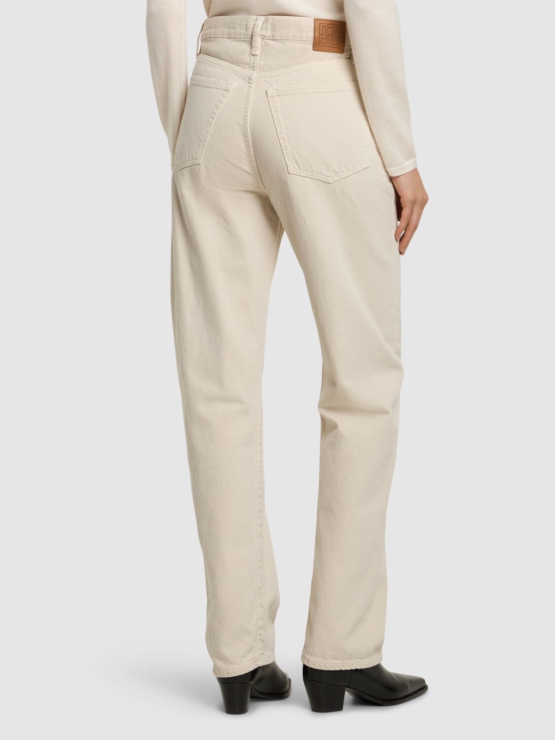 Shop Totême Twisted Seam Mid Rise Denim Jeans In Grey