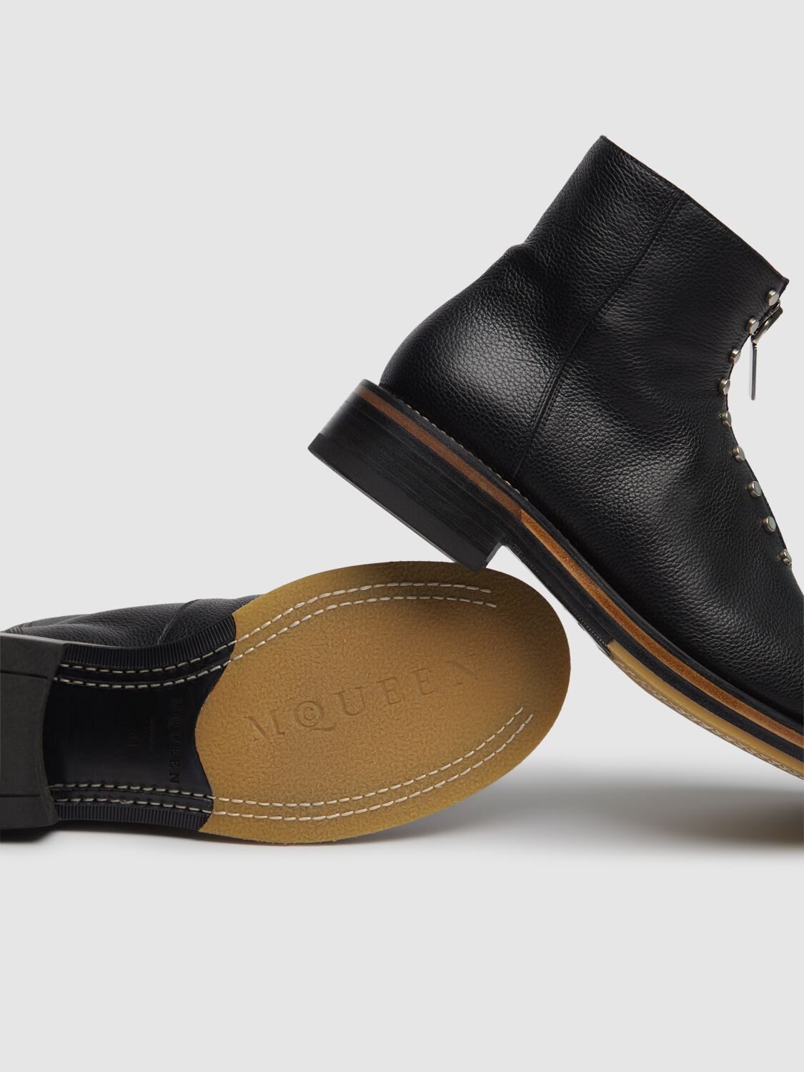 Alexander Mcqueen Chunky Sole Round Toe Studded Ankle Boots In Black