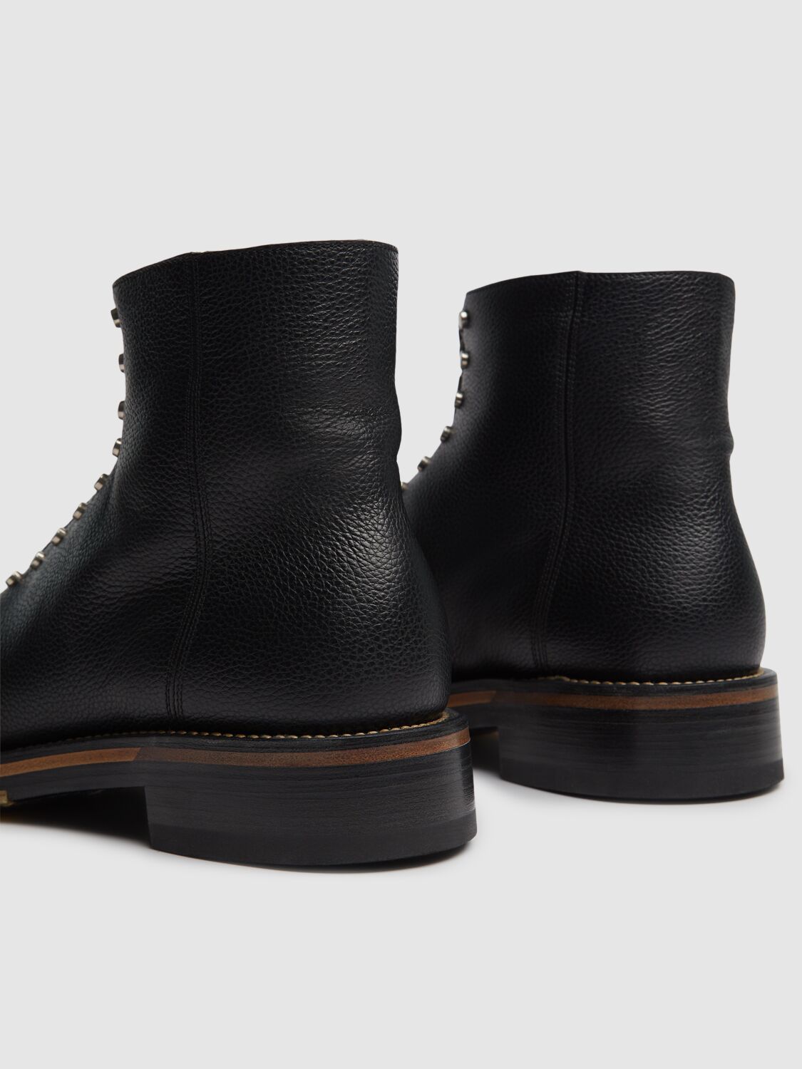 Alexander Mcqueen Chunky Sole Round Toe Studded Ankle Boots In Black