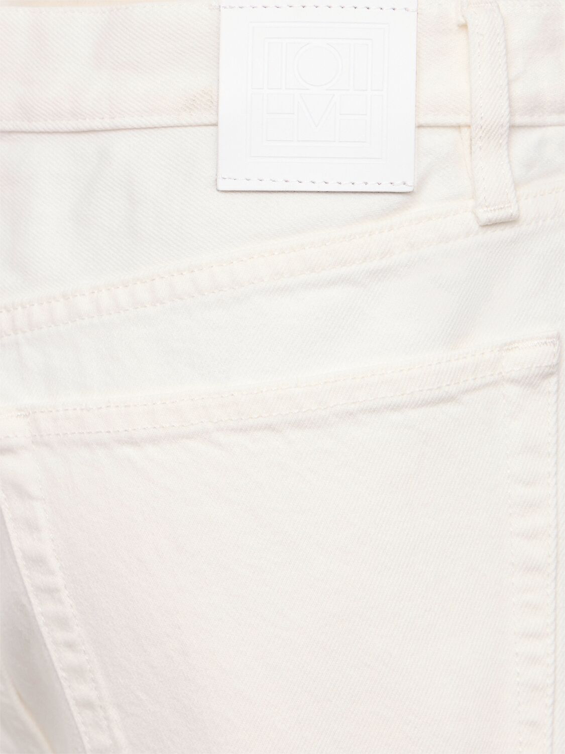 Totême Twisted Seam Organic Cotton Denim Jeans In Black