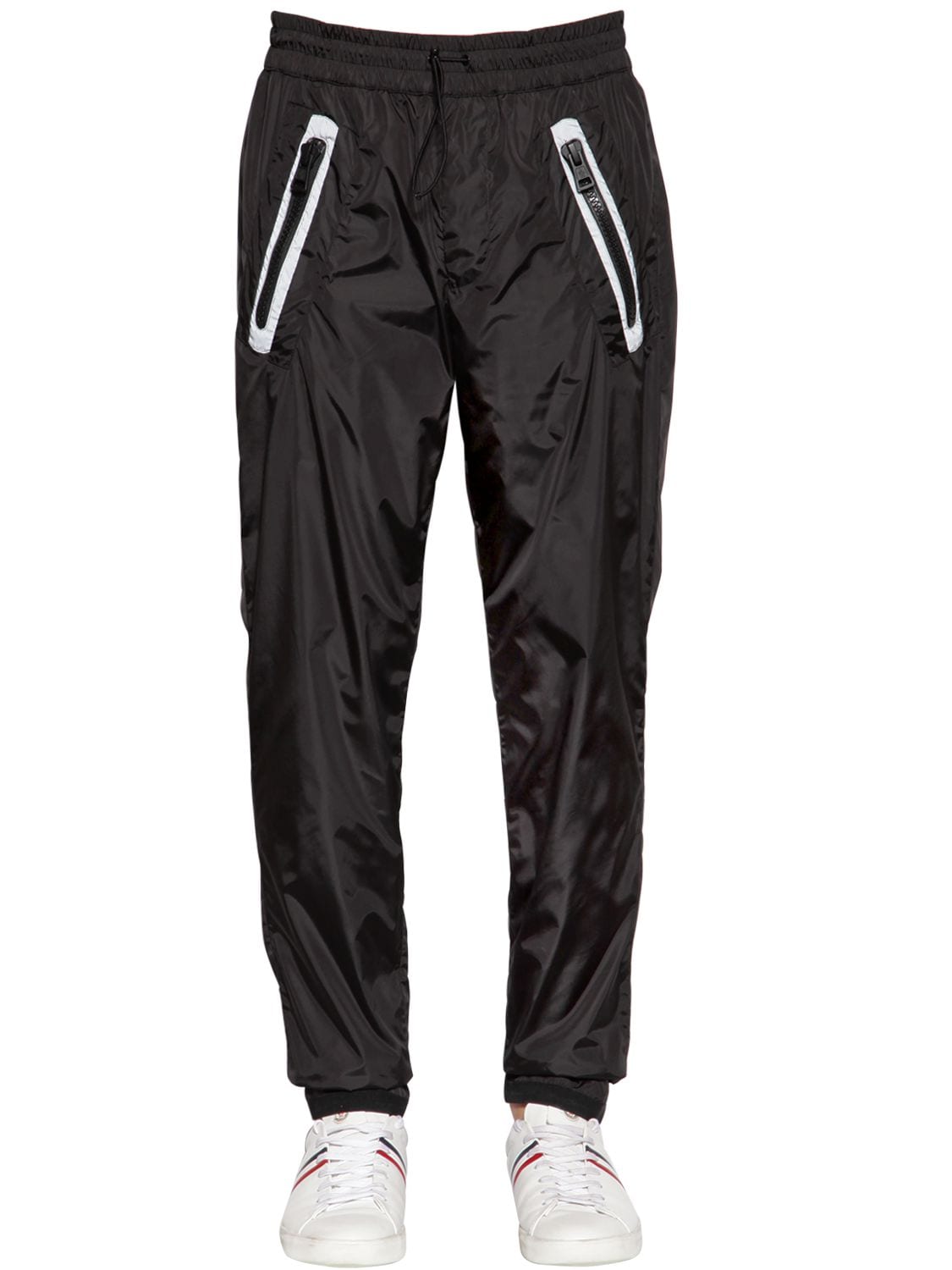 Moncler Tapered Reflective-trimmed Shell Trousers In Black
