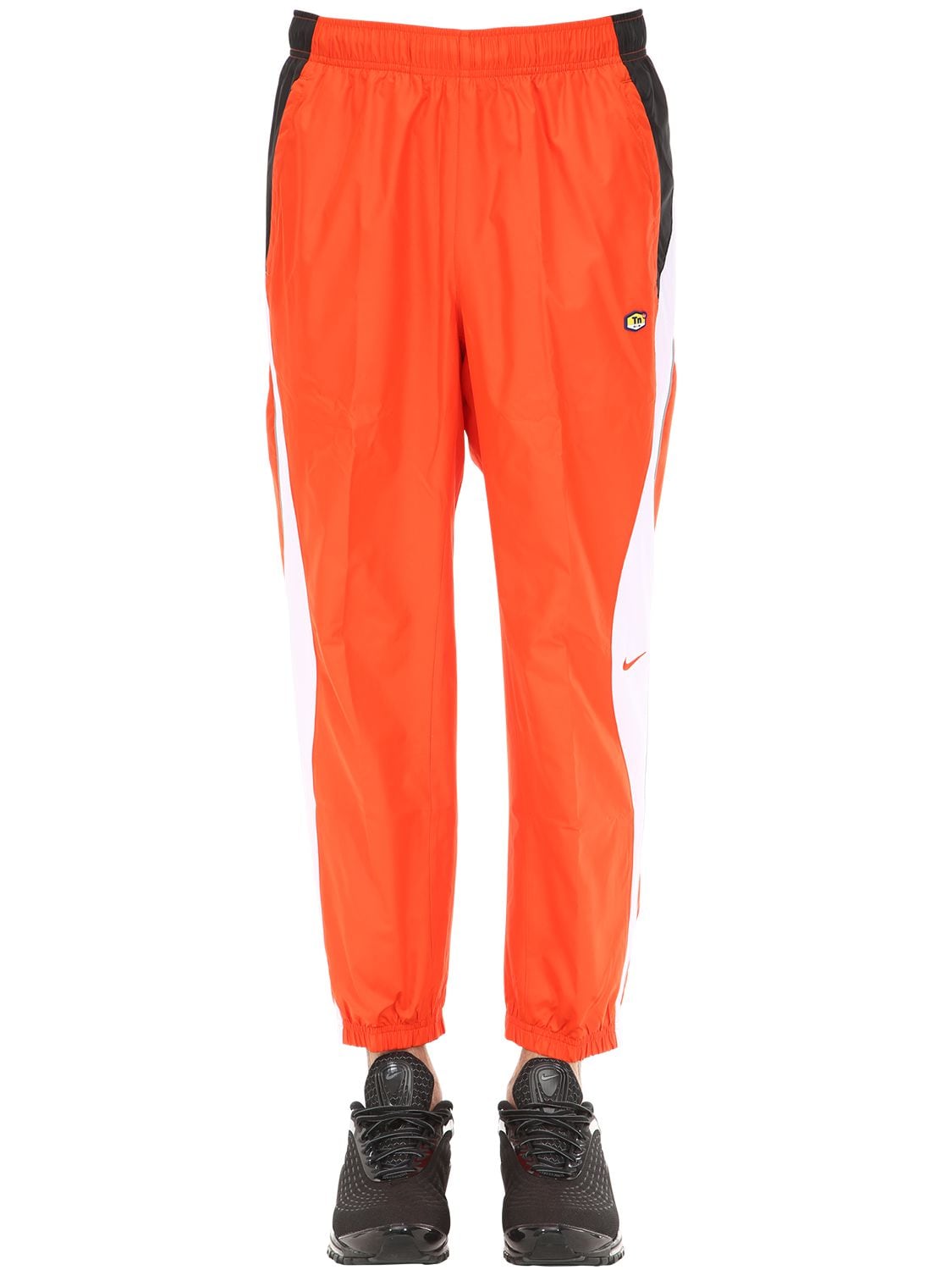 nike orange track pants