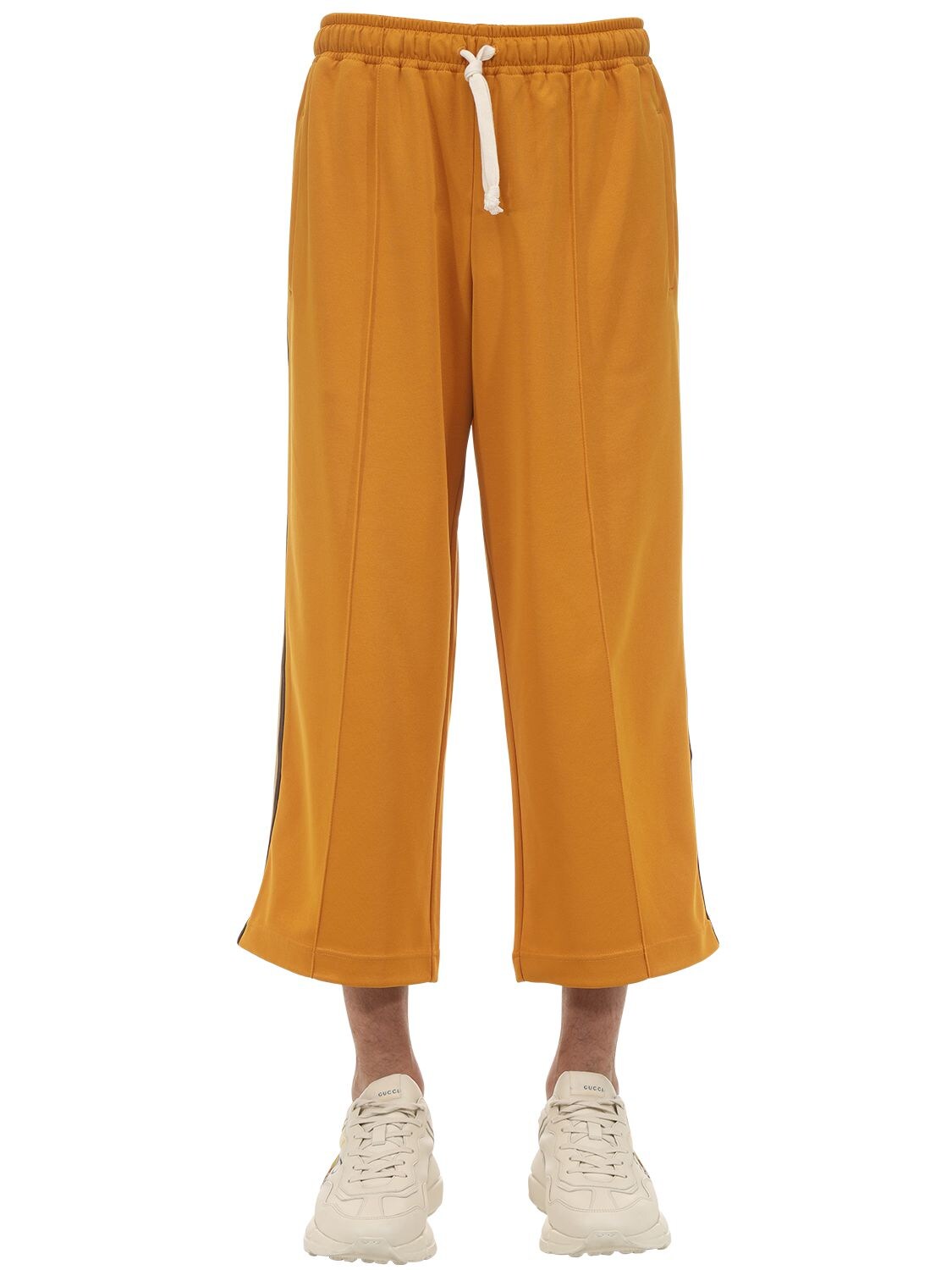 Gucci Cropped Techno Cotton Blend Jersey Trousers In Orange