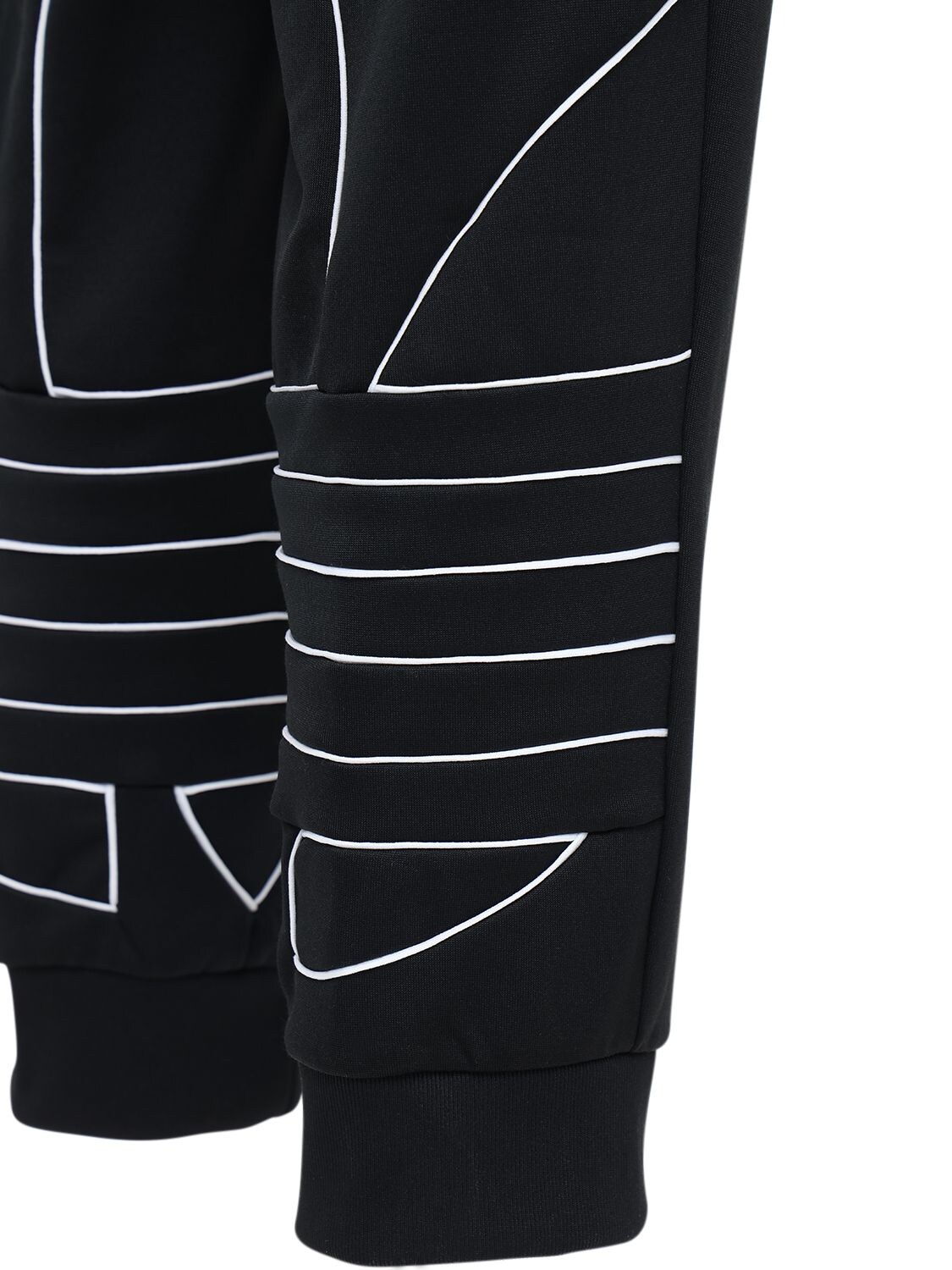 big trefoil outline track pants