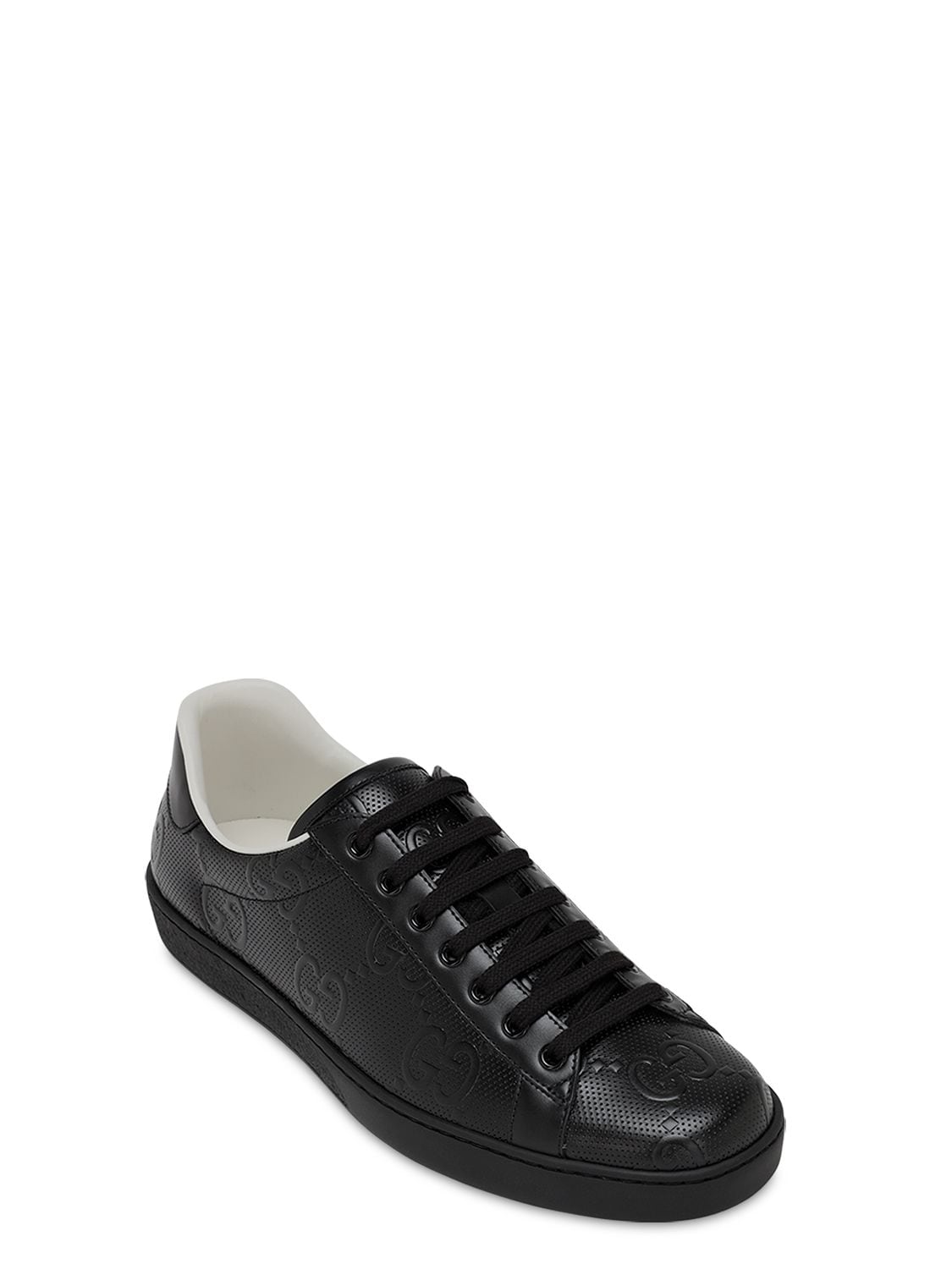 Shop Gucci New Ace Gg Embossed Leather Sneakers In Black