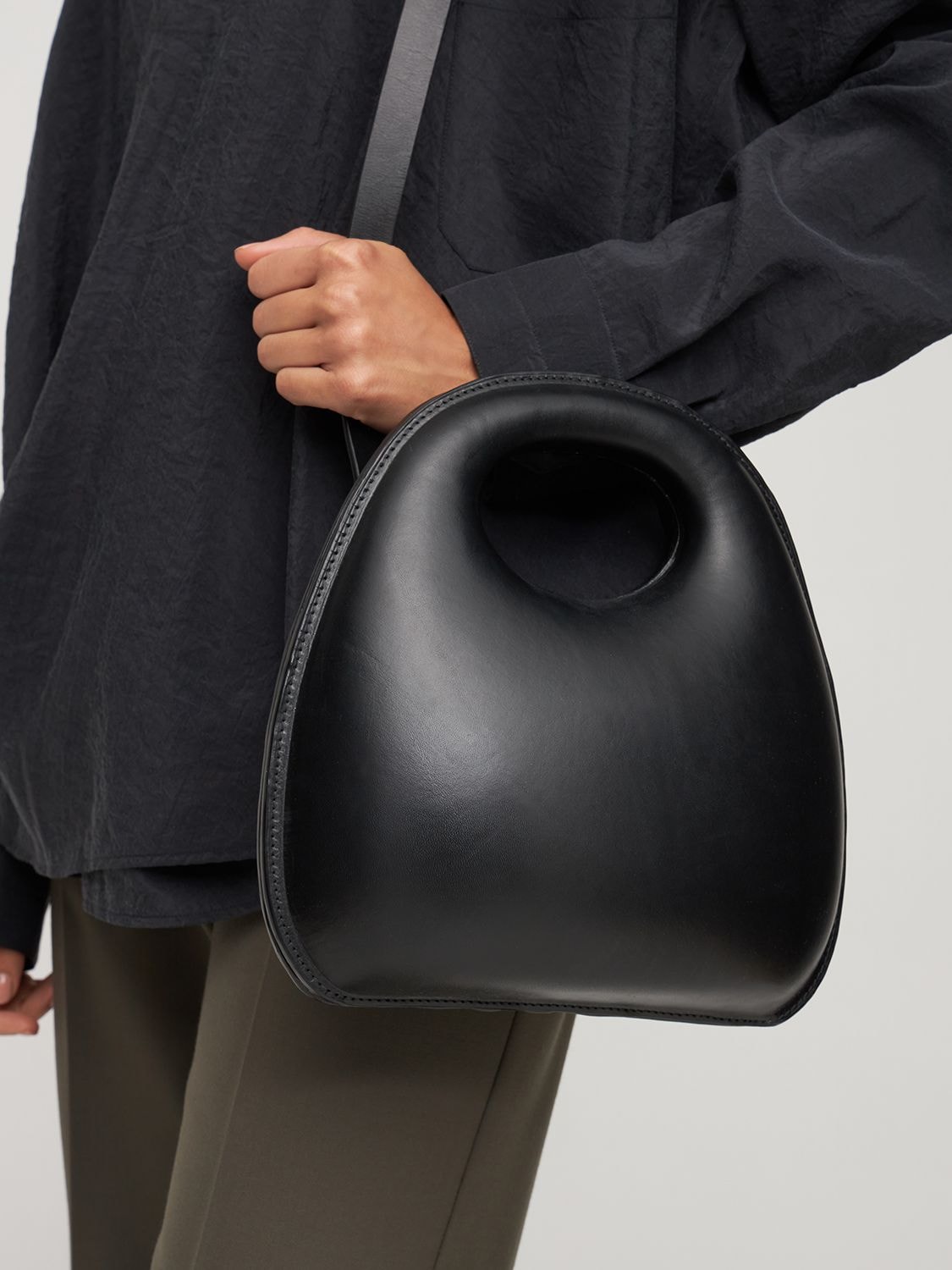 Shop Lemaire Leather Egg Top Handle Bag In Black