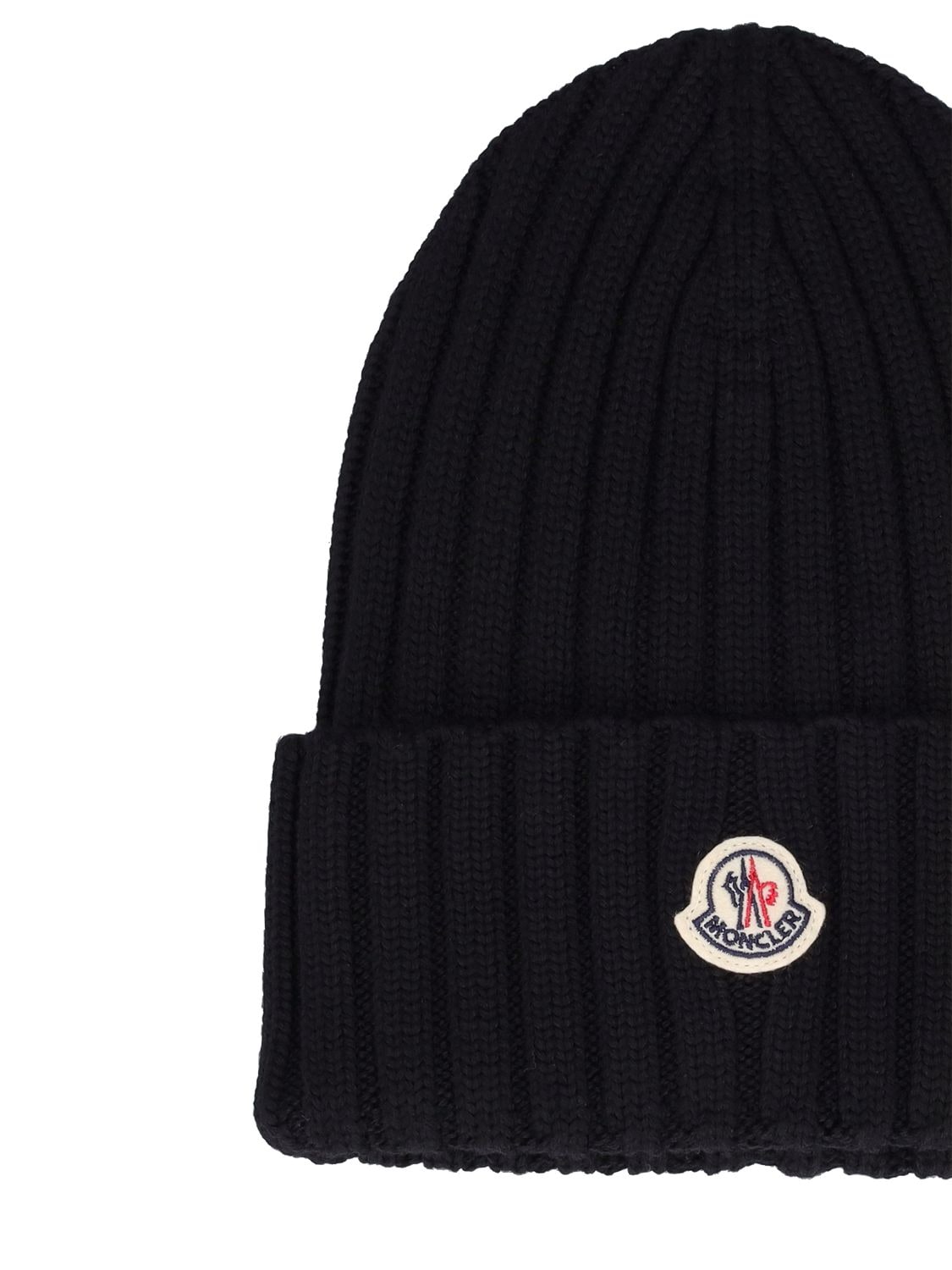 Shop Moncler Knitted Wool Hat In Black