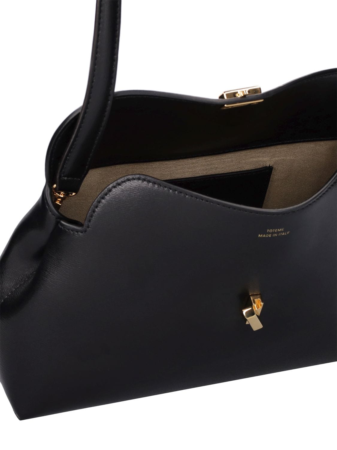 Shop Totême T-lock Pebble Leather Top Handle Bag In Black