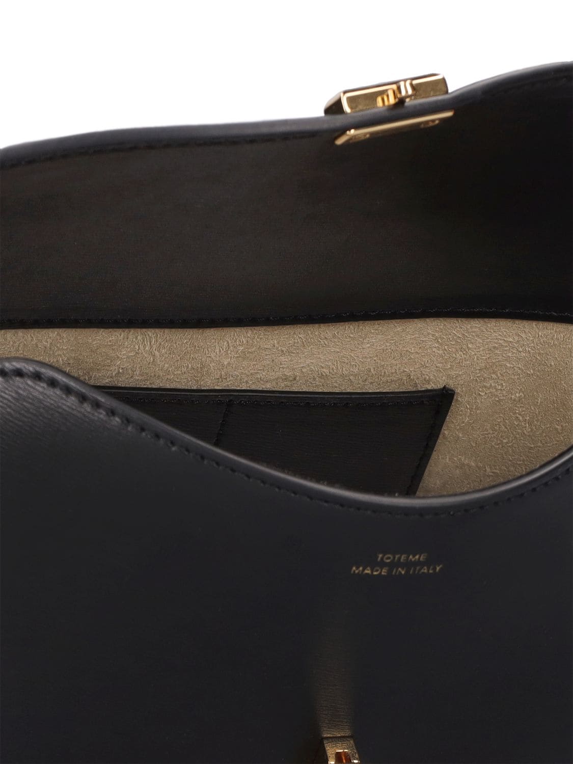 Shop Totême T-lock Palmellata Leather Clutch In Black