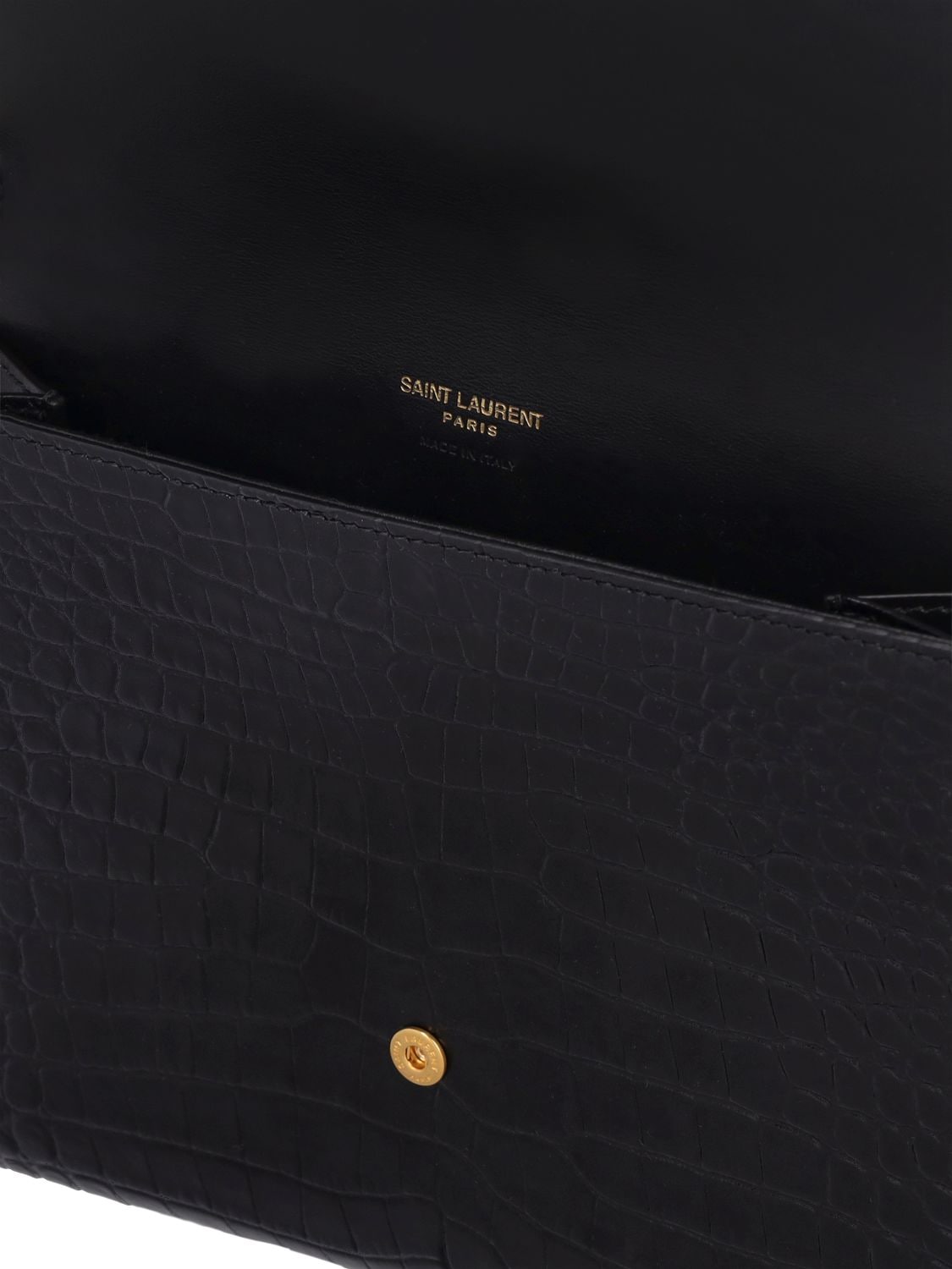 Shop Saint Laurent Cassandre Embossed Leather Clutch In Black