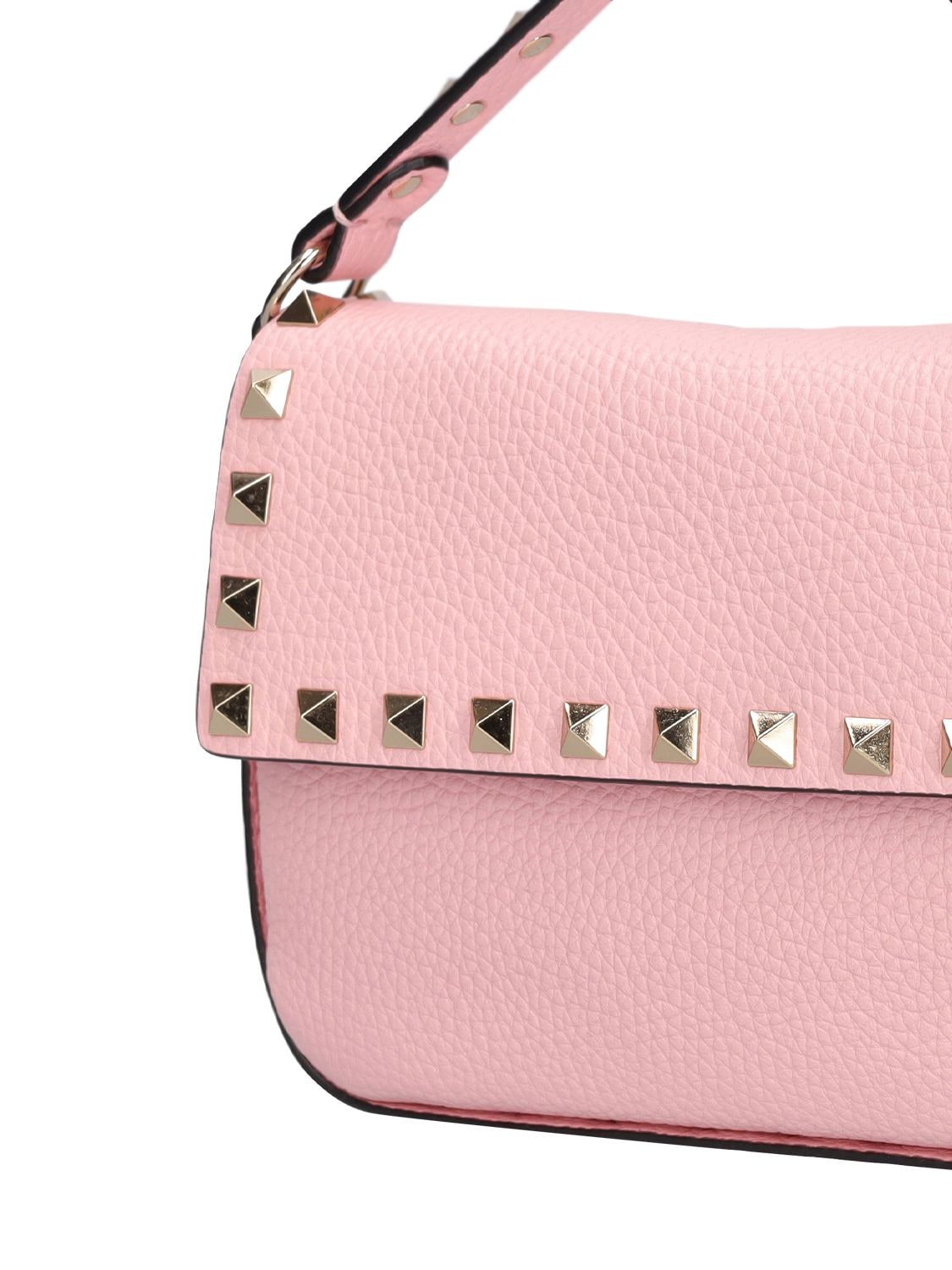 Shop Valentino Rockstud Leather Pouch In Rose Couture