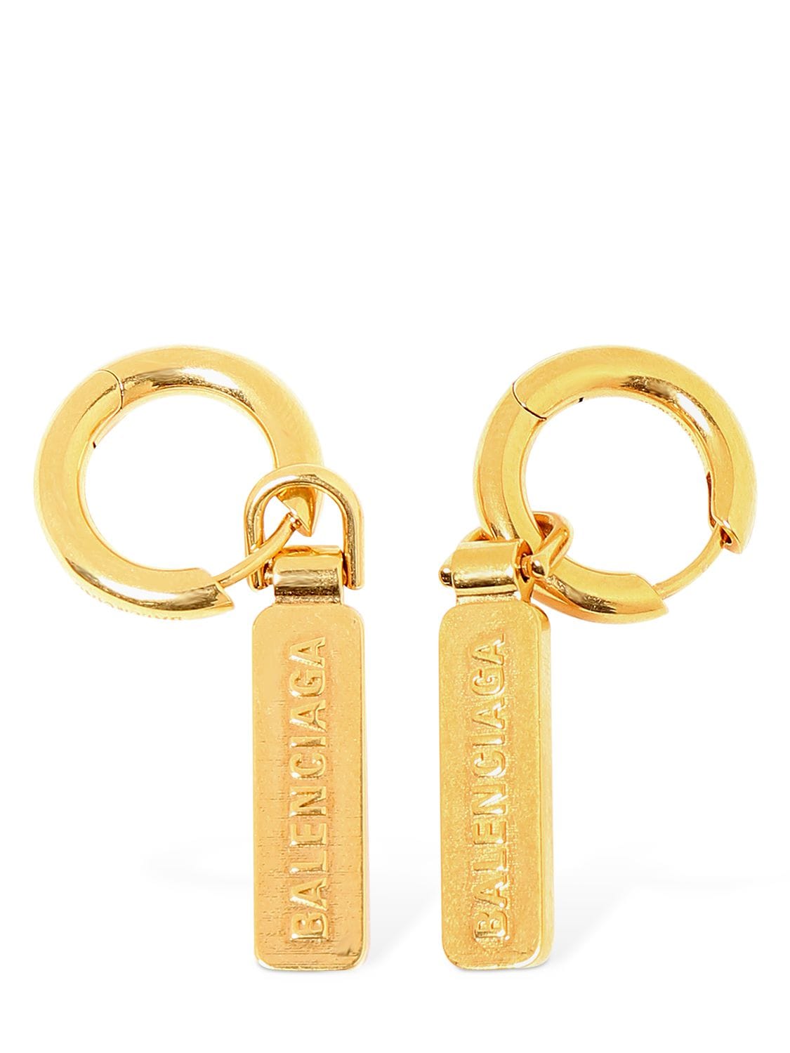 Shop Balenciaga Skate Tag Brass Earrings In Gold