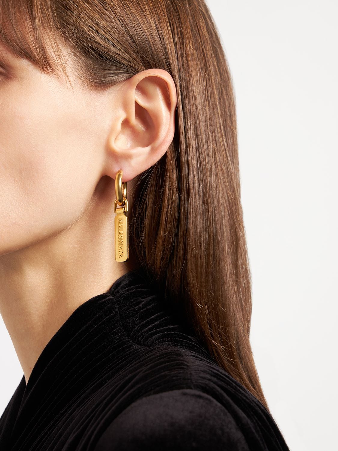 Shop Balenciaga Skate Tag Brass Earrings In Gold